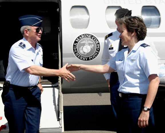 Gen. Duncan McNabb is greeted on the flightline here at Joint BaseCharleston, S.C., by Col. Martha Meeker May 10, 2010. General McNabb was theguest speaker at the naming ceremony for the commercial vessel, LibertyPromise, at the Naval Weapons Station Charleston. Liberty Promise is one ofthe Liberty Maritime Corporation's maritime vessels.  Liberty's fleettransports bulk, break bulk and bagged commodities as well as a variety ofRoll on and Roll off cargos around the world for the U.S. Government, theUnited Nations, Private Voluntary Organizations and private commercialentities. General McNabb is the Transportation Command commander and Colonel Meeker is Joint Base Charleston's commander. (U.S. Air Force photo/Airman 1st Class Lauren Main)