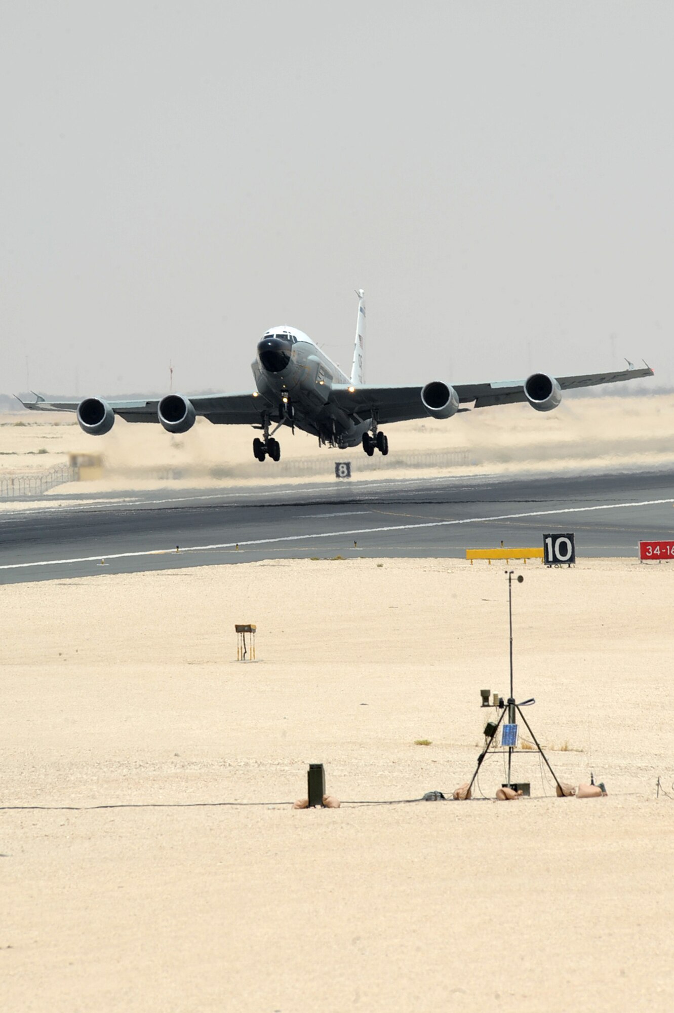 An RC-135V/W Rivet Joint takes-off at non-disclosed Southwest Asia location May 12, 2010. The RC-135 is a reconnaissance aircraft supporting theater and national-level consumers with near real time on-scene intelligence collection, analysis and dissemination capabilities. (U.S. Air Force photo by Senior Airman Kasey Zickmund)[RELEASED]