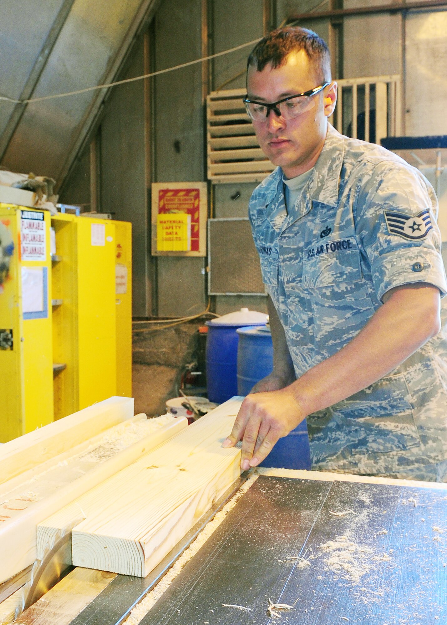 Staff Sgt Nickolas Lagunas works inside the structures shop at the Transit Center at Manas, Kyrgyzstan, May 5, 2010. He is a 376th Expeditionary Civil Engineer Squadron Structural QAE/Humanitarian Assistance member who regularly assists the team with humanitarian assistance outreach including construction in local communities. (U.S. Air Force photo/Senior Airman Nichelle Anderson)