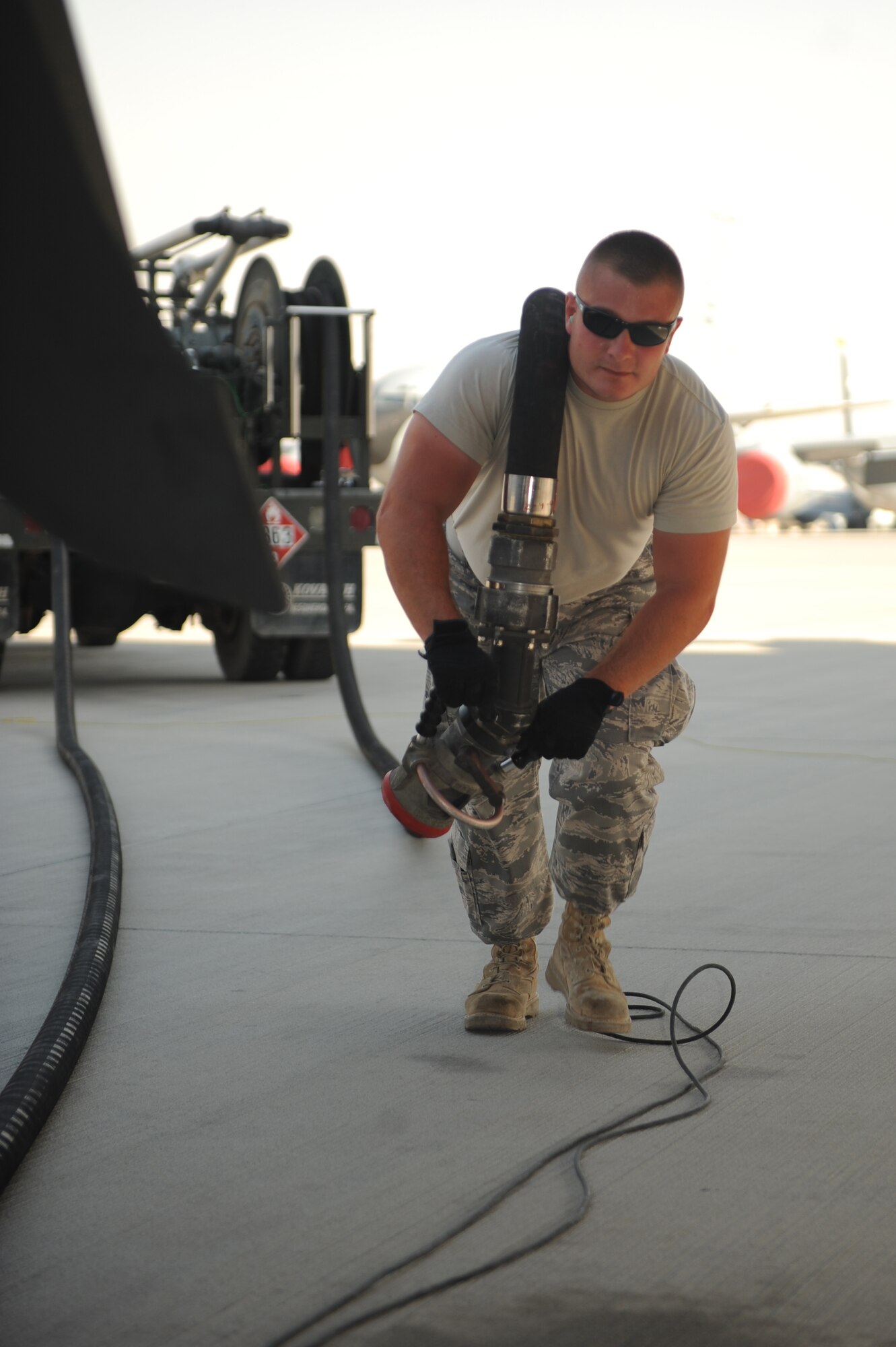 Tech. Sgt. Bradley Childs, 379th Expeditionary Logistics Readiness Squadron fuels craftsman, prepares to fuel a KC-135 at a non-disclosed Southwest Asia location, May 7, 2010. (U.S. Air Force photo by Tech. Sgt. Michelle Larche)[RELEASED]