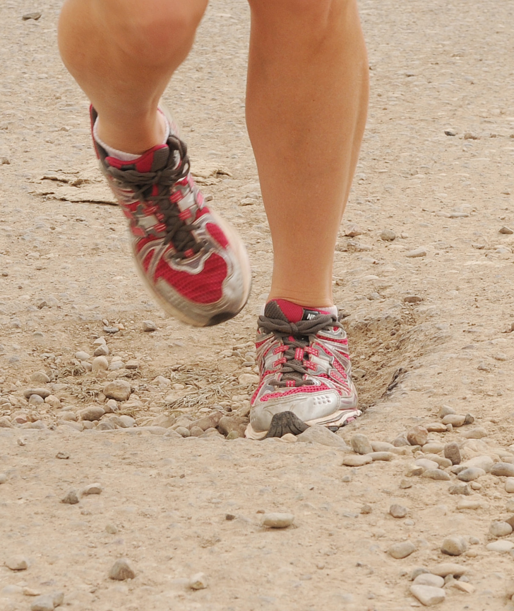 Sharing the road with MRAPS and humvees, uneven pavement littered with potholes and rocks, and the unbearable heat can all have an impact on runners. Please follow the safety tips recommended by the 506th Air Expeditionary Group safety office: run facing traffic, have a wingman, pay attention to your surroundings, be watchful of uneven surfaces, stay away from the wild life such as dogs, foxes, snakes etc., tell people where you are going and when you are going to get back, and hydrate to prevent heat related injuries.  (U.S. Air Force photo/Master Sgt. Martie Moore/Released)