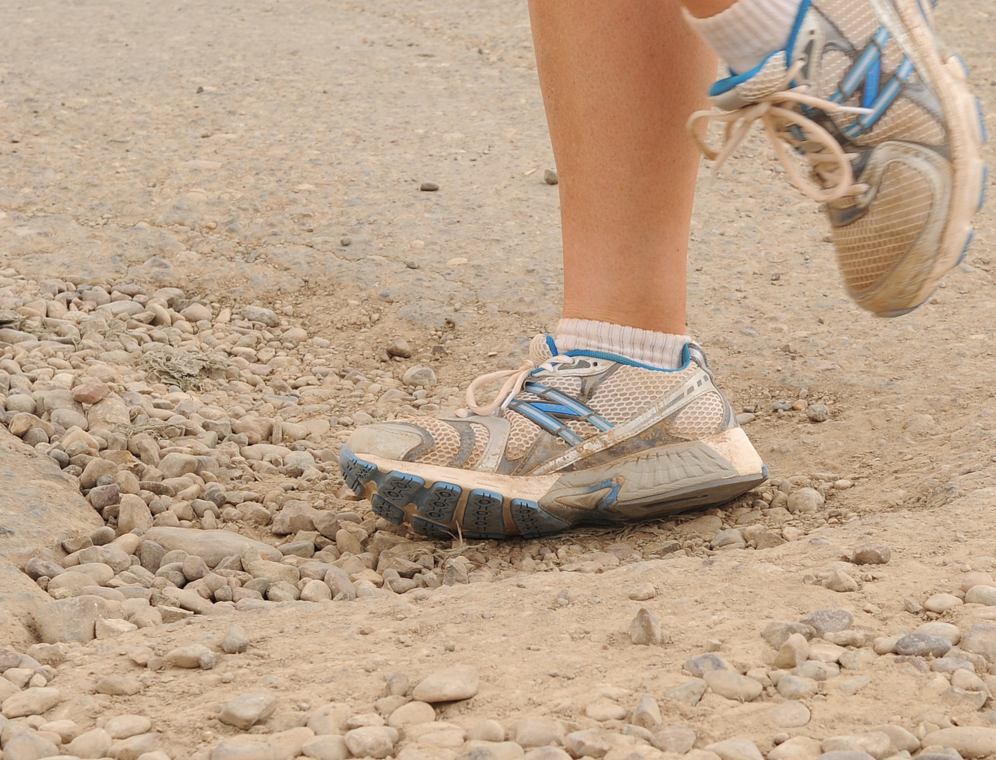 Sharing the road with MRAPS and humvees, uneven pavement littered with potholes and rocks, and the unbearable heat can all have an impact on runners. Please follow the safety tips recommended by the 506th Air Expeditionary Group safety office: run facing traffic, have a wingman, pay attention to your surroundings, be watchful of uneven surfaces, stay away from the wild life such as dogs, foxes, snakes etc., tell people where you are going and when you are going to get back, and hydrate to prevent heat related injuries.  (U.S. Air Force photo/ Staff Sgt. Tabitha Kuykendall/Released)