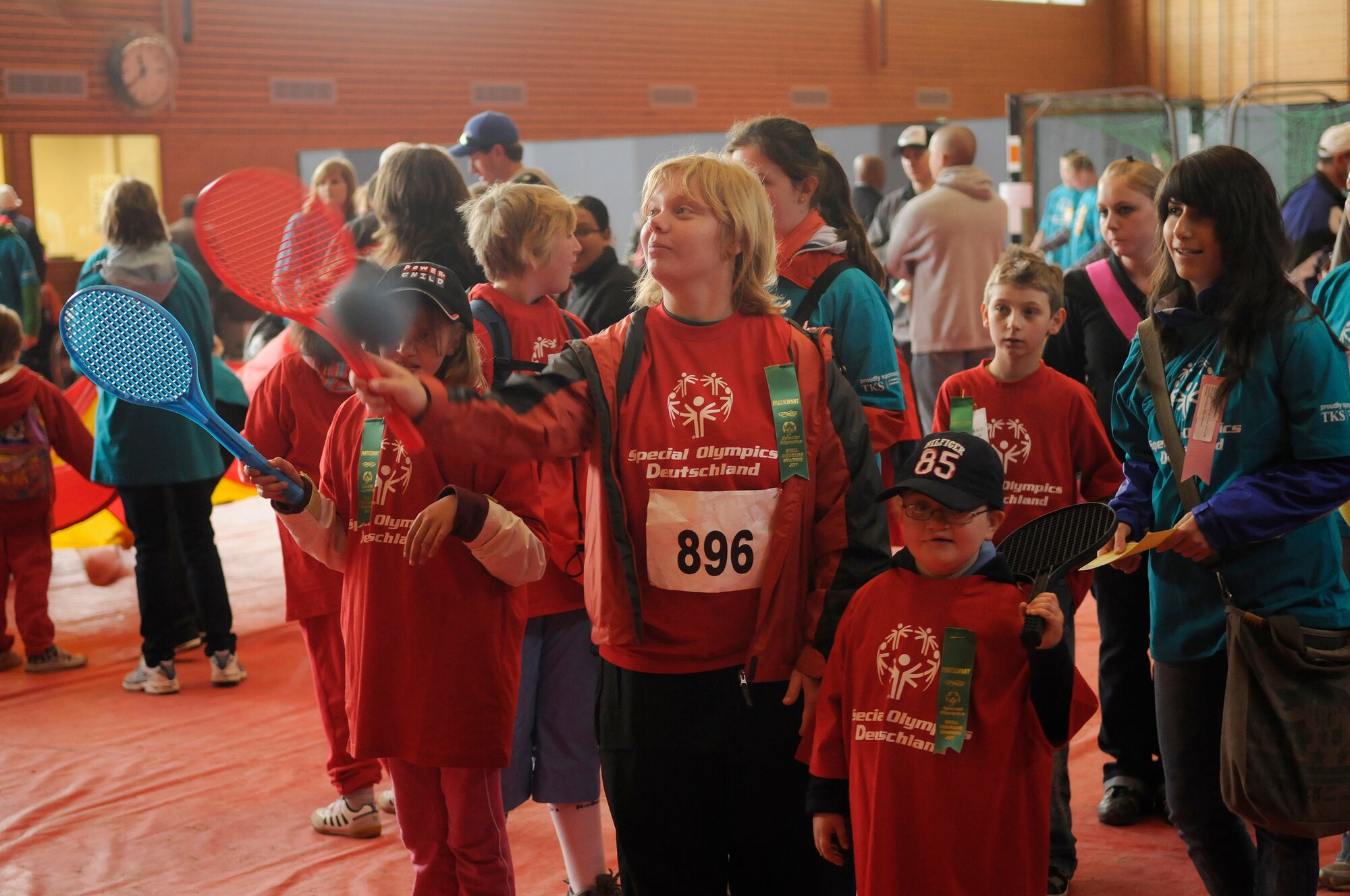 Athletes participate in racket ball as their buddies look on during the Special Olympics held in Enkenbach-Alsenborn, Germany, May 12, 2010. Special Olympics is a worldwide event for children and adults with disabilities to build confidence and foster friendship. The Kaiserslautern Military Community hosted its 27th Annual Special Olympics for over 800 athletes. (U.S. Air Force photo by Airman 1st Class Desiree Esposito)