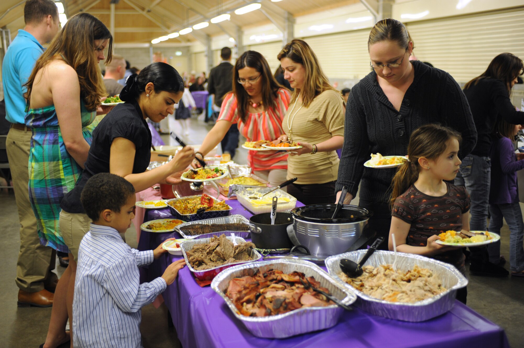 RAF MENWITH HILL, United Kingdom - Members of the Menwith Hill community were treated to a Potluck dinner in celebration of Mother's Day at the Pavilion, May 10. The dinner, hosted by the chapel, was open to the entire Menwith Hill community as a way to say "thank you" to all the Mothers here. Approximately 150 people attended the dinner. (U.S. Air Force photo/Staff Sgt. Brok McCarthy)