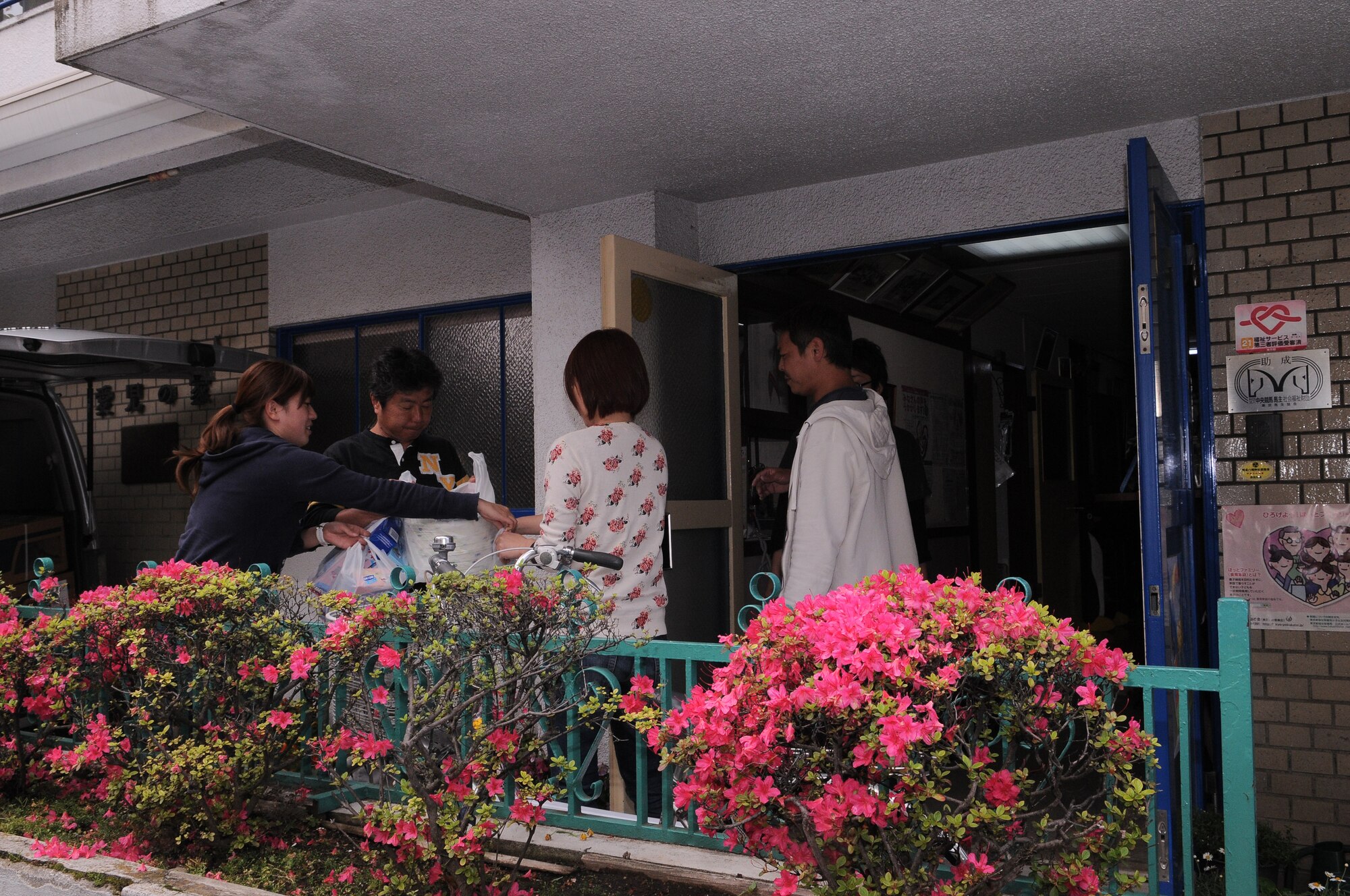 YOKOTA AIR BASE, Japan -- Employees at the Aiji no Ie orphanage unload a vehicle full of goods donated by 'Team Yokota' member, Mr. Kendall Carter. Aiji no Ie translated means House of Affection. The orphanage has 36 children ranging in ages from 2 to 17. (U.S. Air Force photo/ Airman 1st Class Lynsie Lorenz)