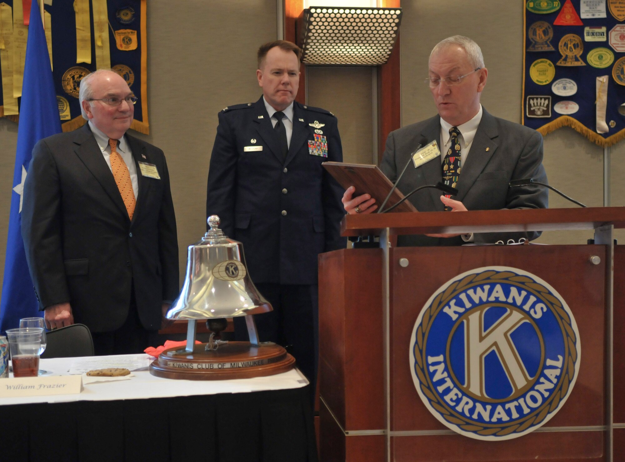 Col. Ted Metzgar, commander of the 128th Air Refueling Wing, stands at attention as Dr. Tom Buck, the Civic Dinner Dance co-chairman, reads the proclamation for the wing’s induction into the Kiwanis Club’s Hall of Fame during the Kiwanis Club Luncheon on May 12, 2010, at the Milwaukee County War Memorial Center.  (Air Force photo by Senior Master Sgt. Jeff Rohloff/released)