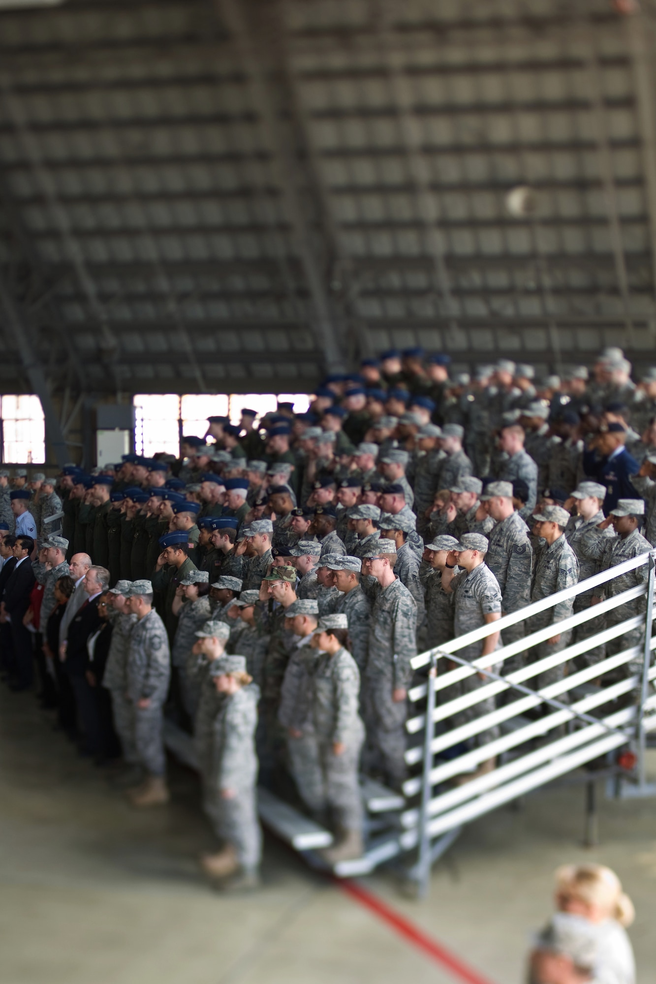 YOKOTA AIR BASE, Japan -- Yokota servicemembers salute during the 374th Airlift Wing change of command ceremony here May 14. In attendance were members of Yokota, the local community and Japan Self-Defense Forces. (U.S. Air Force photo/Osakabe Yasuo)