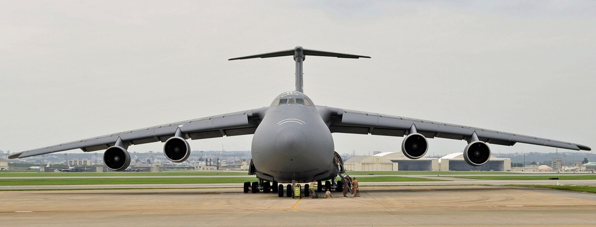 A C-5 Galaxy is prepped for takeoff at Kadena Air Base May 13. Air Mobility Command is re-routing some C-5s and C-17s through the Pacific region from Southwest Asia due to volcanic activity in Iceland that is affecting air traffic. Kadena’s 733rd Air Mobility Squadron is leading the effort to keep aircraft and people flowing through the base on their way to Southwest Asia. (U.S. Air Force photo by Senior Airman Amanda Grabiec)
