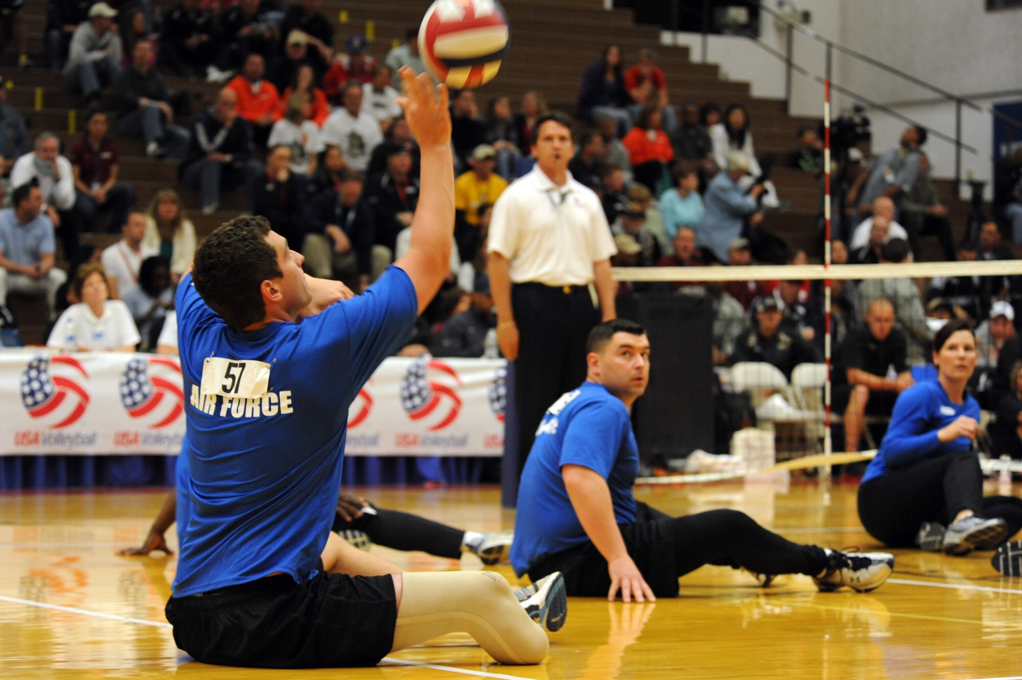 Air Force Warrior Games athlete, 2nd Lt. Ryan McGuire, serves the ball during the Warrior Games sitting volleyball match against Army at the U.S. Olympic Training Center in Colorado Springs, Colo., May 13, 2010. (U.S. Air Force photo/Staff Sgt. Desiree N. Palacios) 
