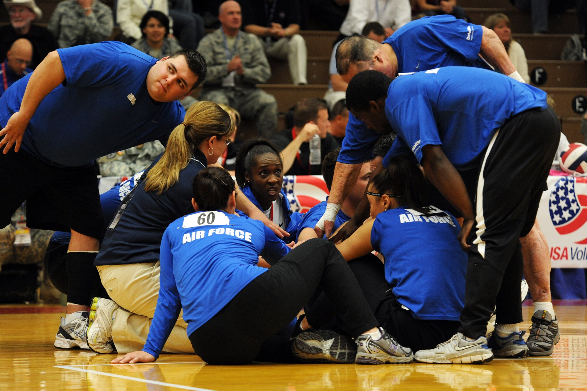 Head Coach Nicki Marino and Air Force Tech. Sgt. Elisha Abercrombie give the Air Force team a pep talk during the Warrior Games sitting volleyball match against Army at the U.S. Olympic Training Center in Colorado Springs, Colo., May 13, 2010. (U.S. Air Force photo/Staff Sgt. Desiree N. Palacios) 