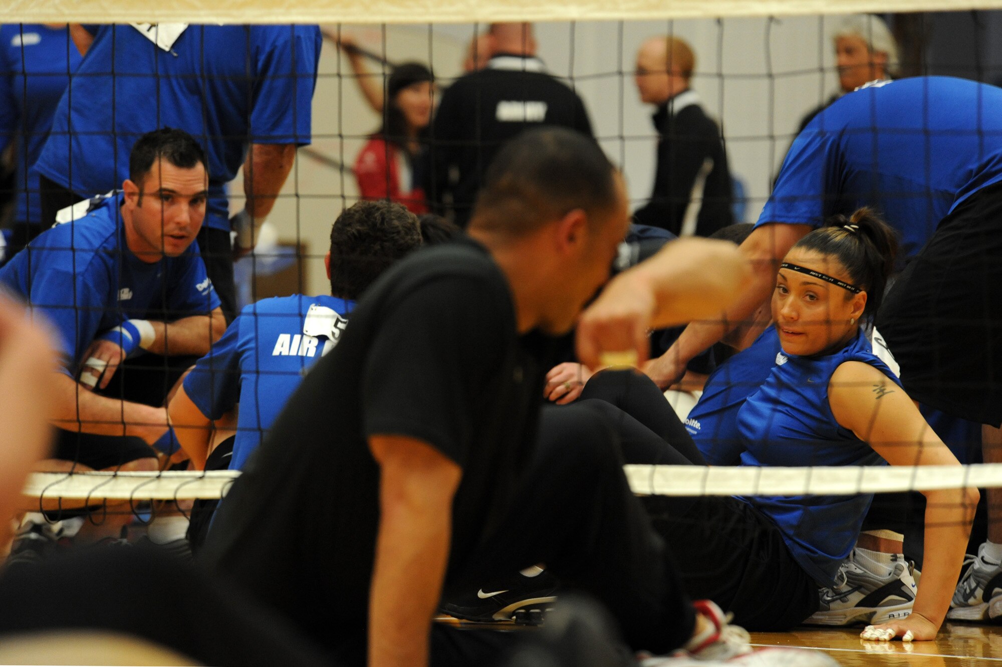 Air Force Warrior Games athletes, Staff Sgt. Christopher D'Angelo and Jennifer Stone, eye their opponents during the Warrior Games sitting volleyball match against Army at the U.S. Olympic Training Center in Colorado Springs, Colo., May 13, 2010. (U.S. Air Force photo/Staff Sgt. Desiree N. Palacios) 