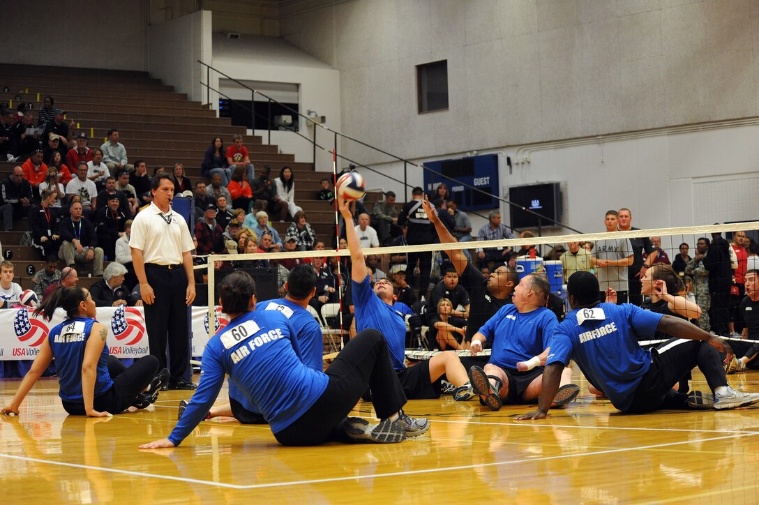 Air Force Warrior Games athlete 2nd Lt. Ryan McGuire hits the ball during the Warrior Games sitting volleyball match against Army at the U.S. Olympic Training Center in Colorado Springs, Colo., May 13, 2010.