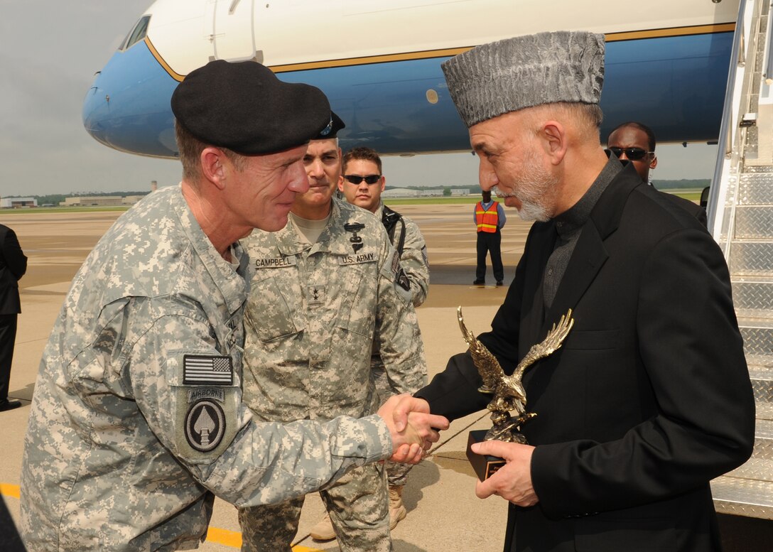 U.S. Army General Stanley McChrystal, commander of the International Security Assistance Forces and commander of U.S. Forces in Afghanistan, says goodbye to President of Afghanistan Hamid Karzai before Karzai boards his aircraft at Campbell Army Airfield, Fort Campbell, Ky., on May 14, 2010.  