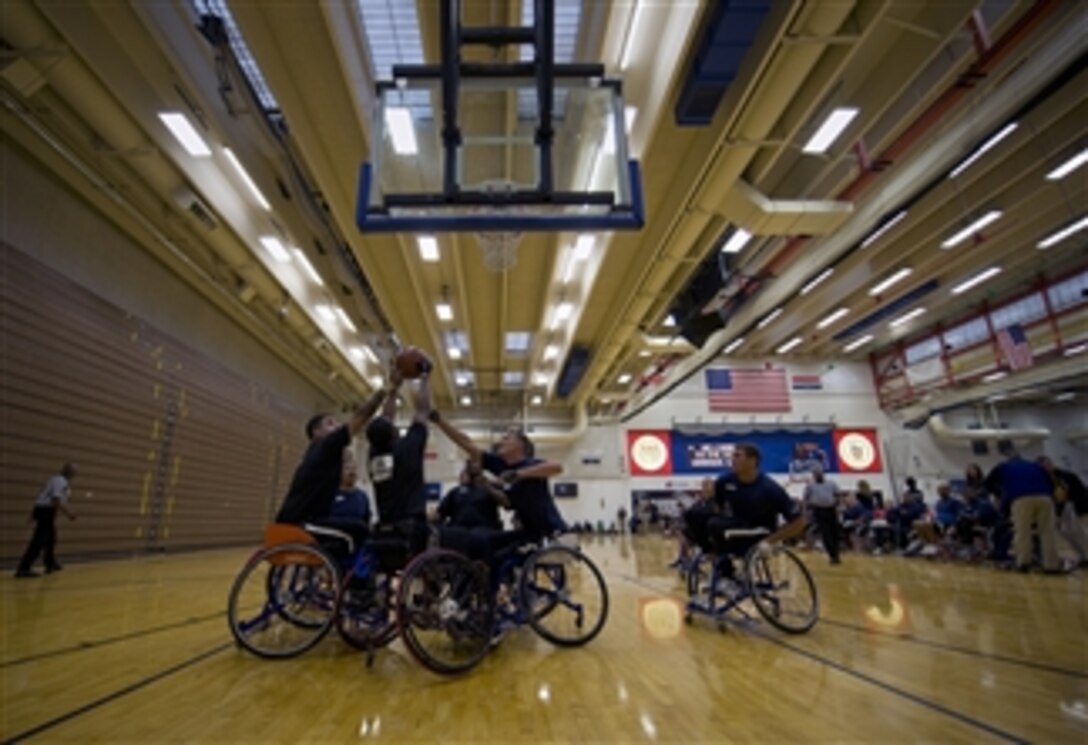 The U.S. Army team defeats the Navy team 15-10 in their preliminary wheelchair basketball game at the inaugural Warrior Games at the U.S. Olympic Training Center in Colorado Springs, Colo., on May 11, 2010.  Nearly 200 personnel from all military branches competed against one another in archery, cycling, track and field, swimming, shooting, sitting volleyball and wheelchair basketball during the event.  