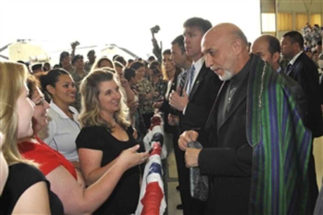 President of Afghanistan Hamid Karzai talks to soldiers and family members at Campbell Army Airfield during a brief visit to Fort Campbell, Ky., May 14, 2010.