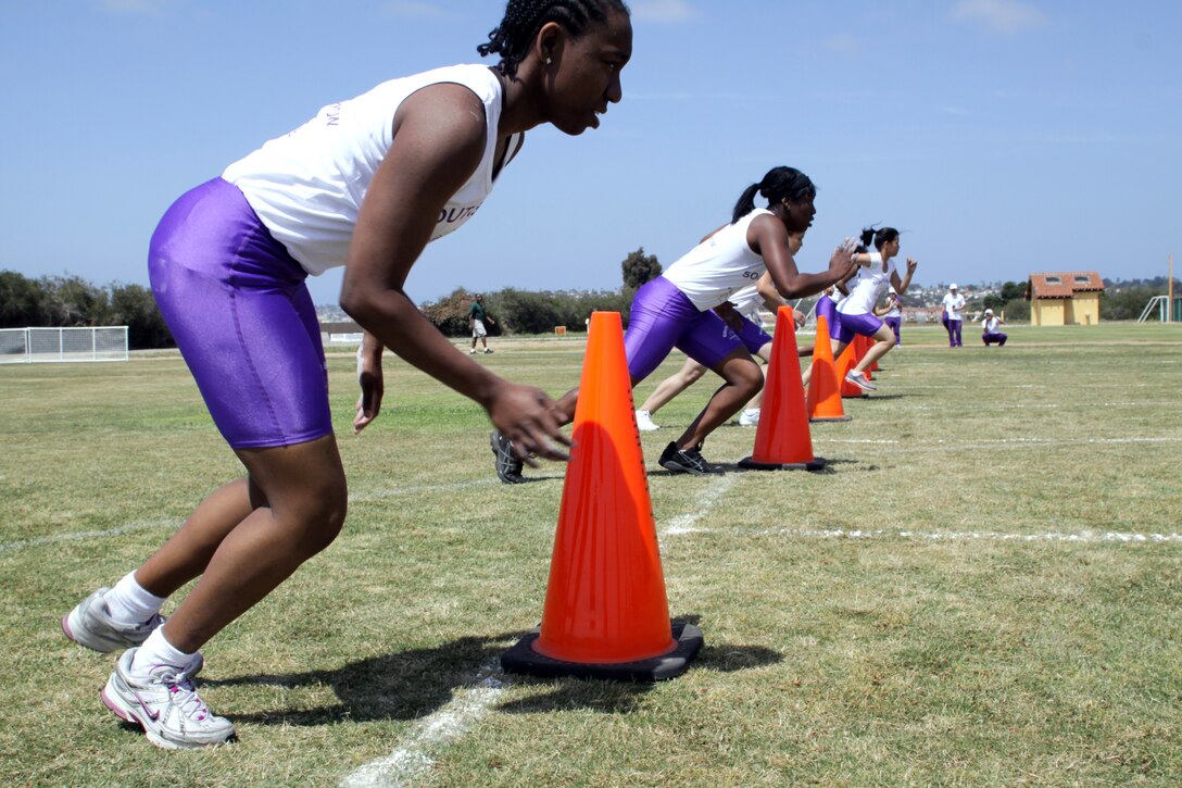 Participants from South Bronx High School, Bronx, N.Y., rapidly take off during the shuttle run portion of the 2010 Youth Physical Fitness Championship, May 14, at the depot’s track and soccer field.