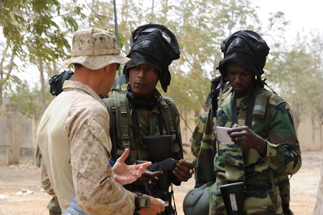 A Marine from the U.S. Marine Corps Forces Special Operations Command instructs Senegalese and Malian counter-terrorism team members on movement tactics prior to conducting operations in an urban terrain environment scenario here May 14 as part of Exercise Flintlock 10. The military training engagement led by MARSOC focused on unit patrols, urban terrain scenarios and CT operations.  Flintlock 10 is a special operations forces exercise focused on military interoperability and capacity-building and is part of an AFRICOM-sponsored annual exercise program with partner nations in Northern and Western Africa.  The exercise, which includes participation of key European nations, is conducted by Special Operations Command Africa and designed to build relationships and develop capacity among security forces throughout the Trans-Saharan region of Africa. It also provides military training opportunities to foster relationships of peace, security and cooperation in Africa through the Trans-Sahara Counterterrorism Partnership program.  Approximately 1,200 European, African Partner Nation and U.S. personnel from 14 nations are involved in military interoperability activities across the Trans-Saharan region during this event.