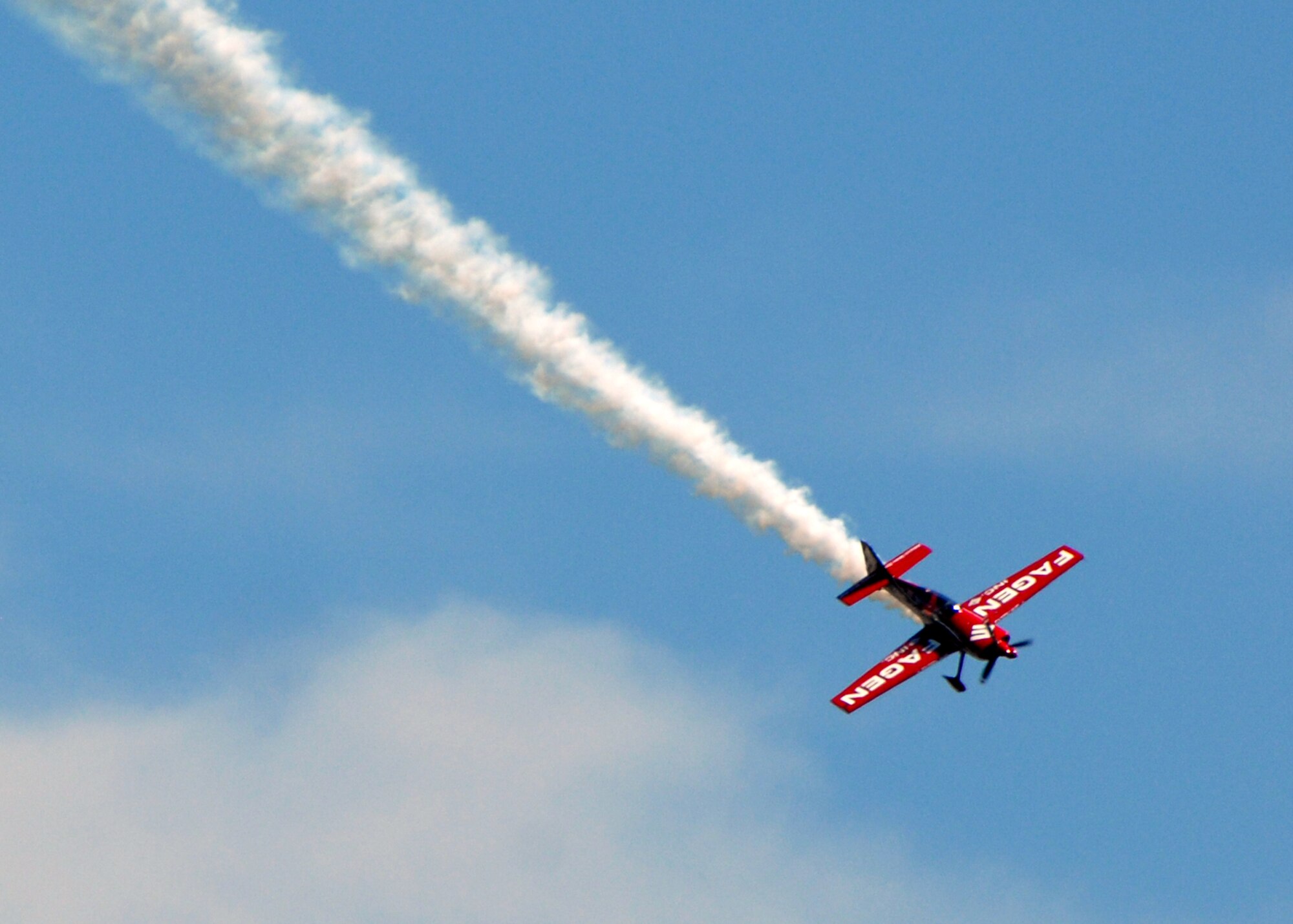 JOINT BASE ANDREWS, Md. - Greg Poe, Fagen MX2 performance pilot, performs in front of the crowds on opening day at the 2010 Joint Service Open House here May 15.  This is the first Joint Service Open House conducted by Team Andrews members at the newly minted Joint Base Andrews, continuing a rich tradition of partnership and strength rooted in service to the nation.  (U.S. Navy photo by Mass Communication Specialist 2nd Class Clifford L. H. Davis)