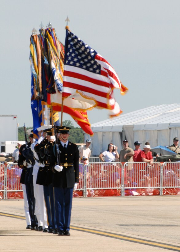 JOINT BASE ANDREWS, Md. - The joint military color guard, from the national capital region, stand ready to present the colors at the opening ceremonies of  the Joint Service Open House here May 15.  This is the first Joint Service Open House conducted by Team Andrews at the newly minted Joint Base Andrews, continuing a rich tradition of partnership and strength rooted in service to the nation.  (U.S. Navy photo by Mass Communication Specialist 2nd Class Clifford L. H. Davis)