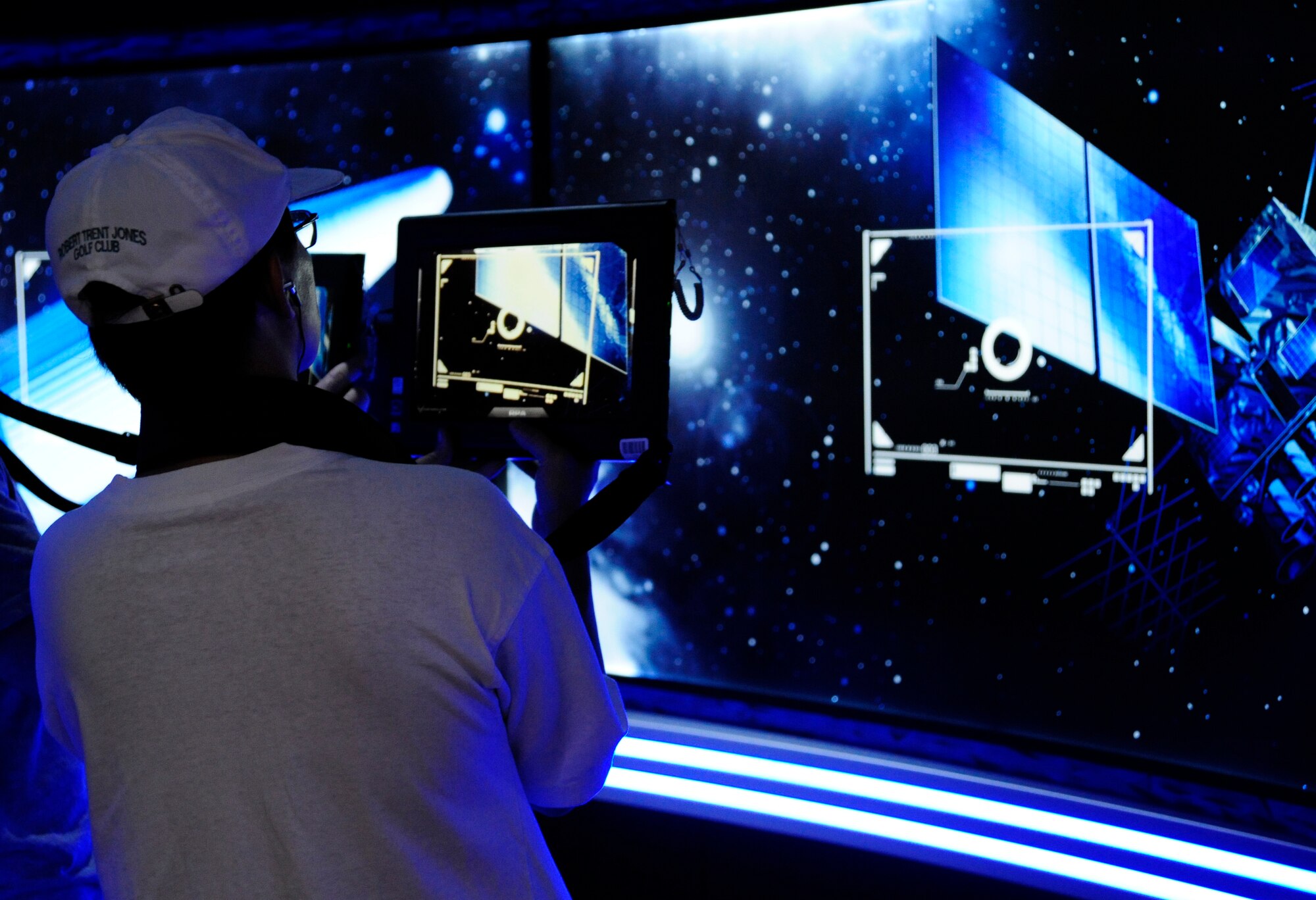 JOINT BASE ANDREWS, Md. - A participant of the ‘Air Force Experience’ sites his target using Virtual Air Force space equipment during the Joint Service Open House here May 15. The high-tech equipment is one of many used inside the ‘Air Force Experience’ exhibit. JSOH offers interaction for all members of the joint service community and the public. (U.S. Air Force photo by Staff Sgt Keyonna Fennell)