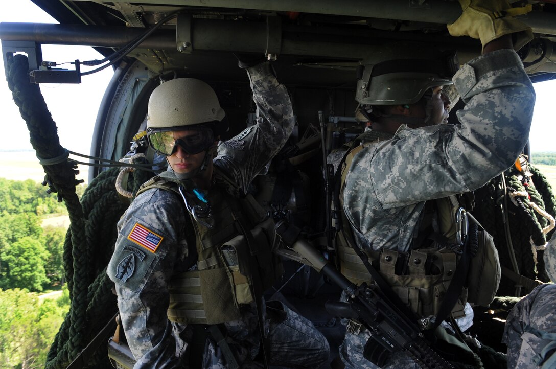 JOINT BASE ANDREWS, Md. -- U.S. Army Special Forces soldiers are mobilized for a Fast Rope Infiltration/Exfiltration demonstration on a UH-60 Blackhawk Aircraft . This system was designed to provide special operations forces access to areas where helicopters are unable to land. The demonstration is part of the Joint Service Open House 2010 held here May 14-16. (U.S. Air Force photo by Senior Airman Melissa V. Brownstein)