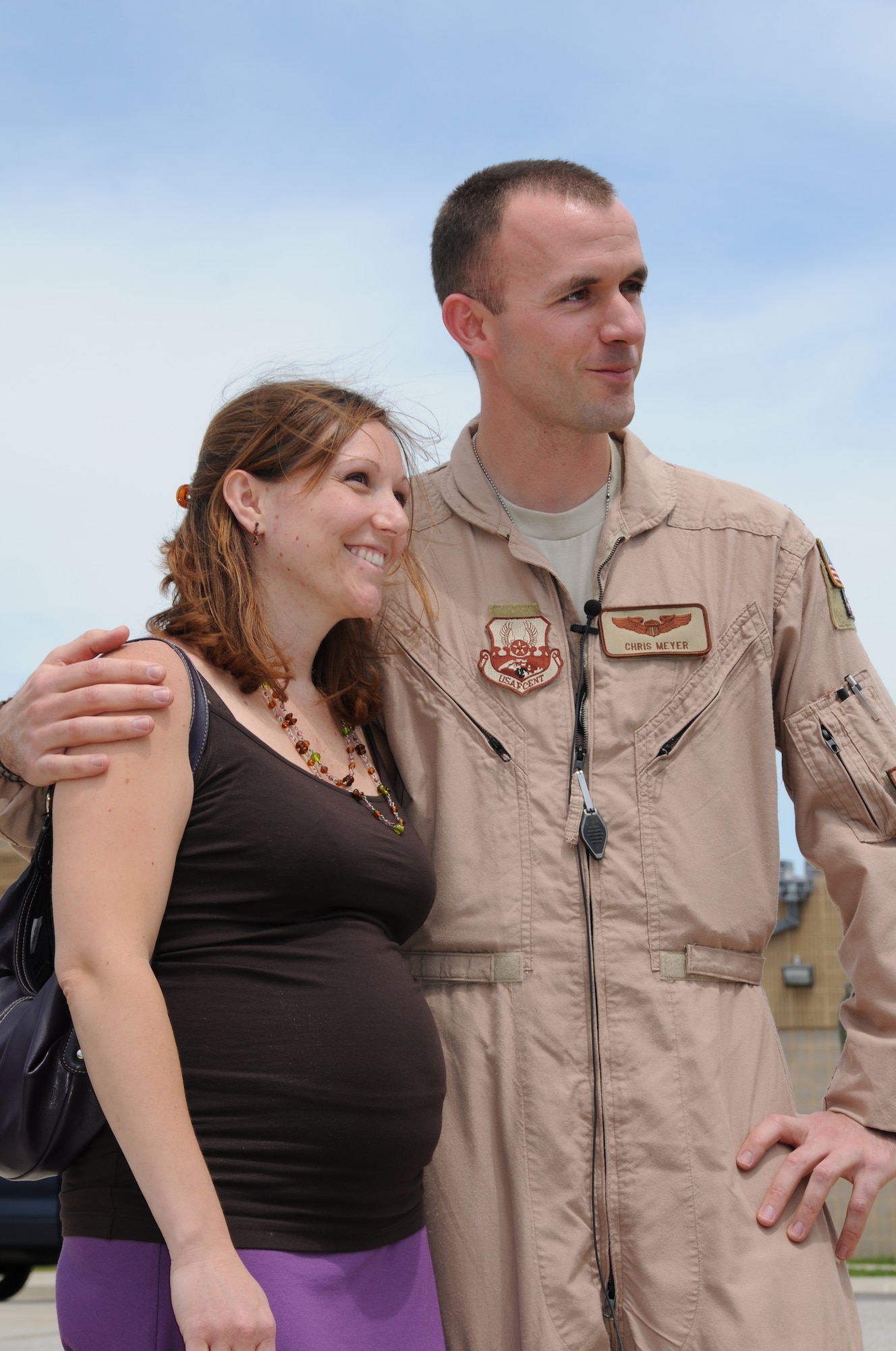 U.S. Air Force Capt. Chris Myers, a C-130J pilot with the Maryland Air National Guard, hugs his wife, Holly, on the flightline on Warfield Air National Guard Base, Baltimore, Md., May 15, 2010.  Captain Myers supported forces fighting in Afghanistan through transporting of supplies and cargo.  (U.S. Air Force photo by Staff Sgt. Benjamin Hughes/Released) 