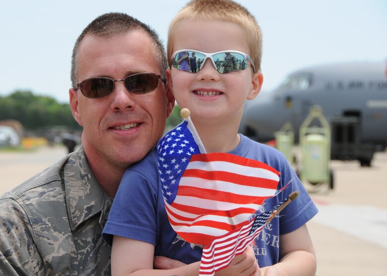 U.S. Air Force Tech Sgt. John Jones of the Maryland Air National Guard’s 135th Maintenance Squadron, hugs his son, Nathan on the flight line on Warfield Air National Guard Base, Baltimore, Md., May 15, 2010.  Sergeant Jones, a C-130 maintainer, and the 135th supported forces fighting in Afghanistan through transport supplies and cargo.  (U.S. Air Force photo by Staff Sgt. Benjamin Hughes/Released) 