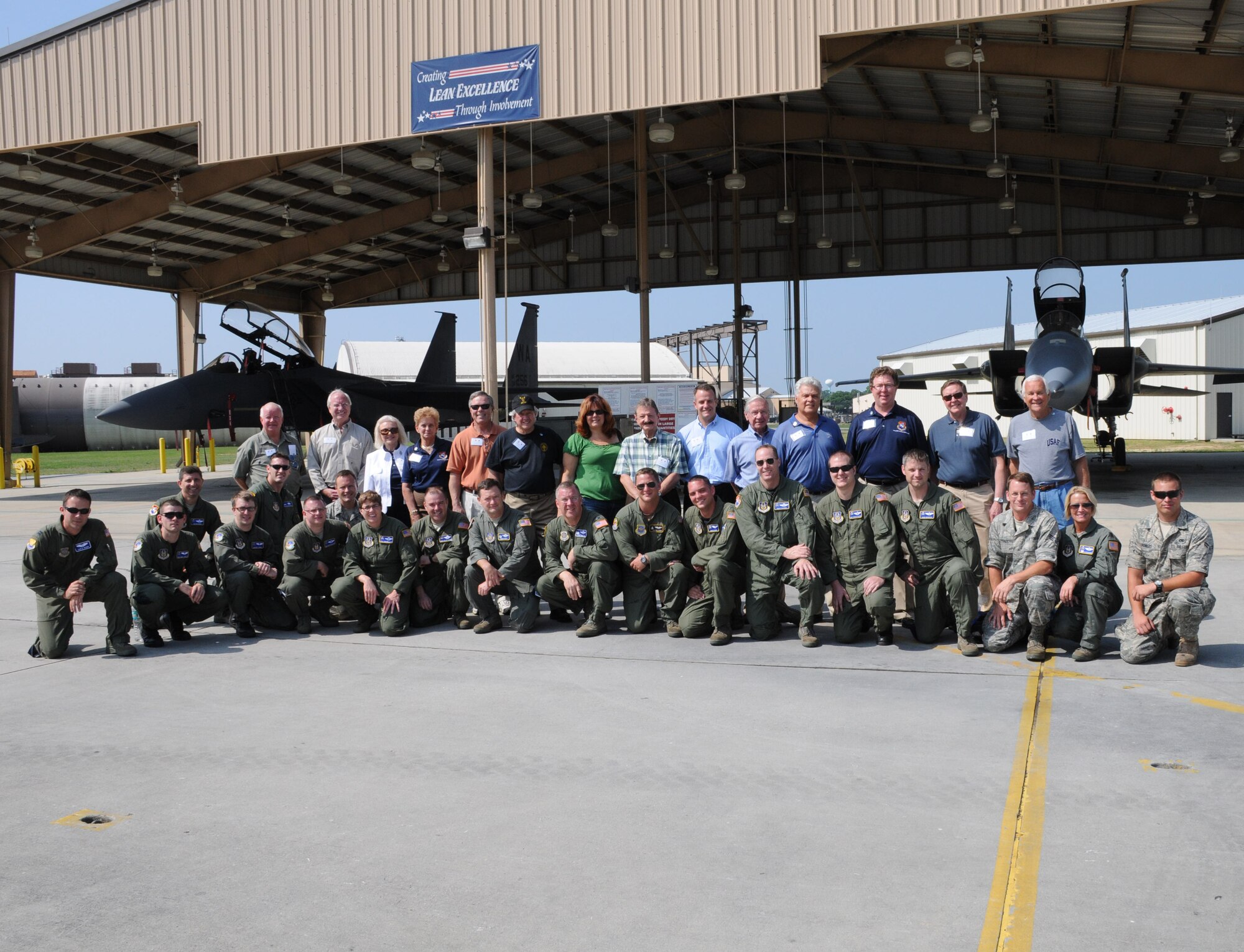 Civic leaders and Airmen from the 927th Air Refueling Wing and 6th Air Mobility Wing at MacDill Air Force Base, Fla., stand in front of two F-15 Eagles at Robins Air Force Base, Ga., during a civic leader tour May 13, 2010. (U.S. Air Force photo by Senior Airman Anna-Marie Wyant)