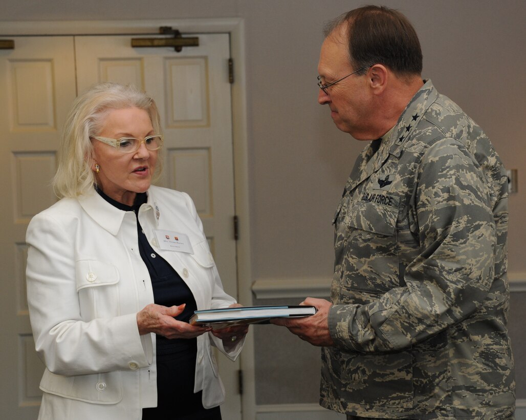 927th Air Refueling Wing Honorary Commander Vivian Reeves presents a gift Lt. Gen. Charles Stenner, Chief of the Air Force Reserve and Commander of the Air Force Reserve Command at Robins Air Force Base, Ga., during a civic leaders tour from MacDill Air Force Base, Fla., May 13, 2010. The gift was a book about Tampa, Fla., given to thank General Stenner for his hospitality during the tour. (U.S. Air Force photo by Senior Airman Anna-Marie Wyant)