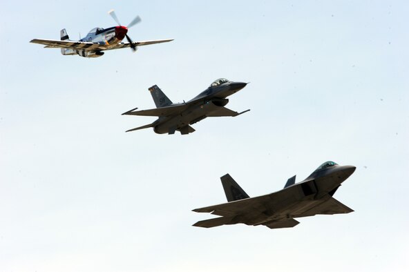 JOINT BASE ANDREWS, Md. -- An Air Force P-51 Mustang, F-16 Falcon, and F-22 Raptor perform a “Heritage Flight” for the crowds at the 2010 Joint Service Open House here May 15.  JSOH allows members of the public an excellent opportunity to meet and interact with the men and women of the Armed Forces and to show them America’s skilled military. (U.S. Air Force photo by Staff Sgt. Christopher A. Marasky)