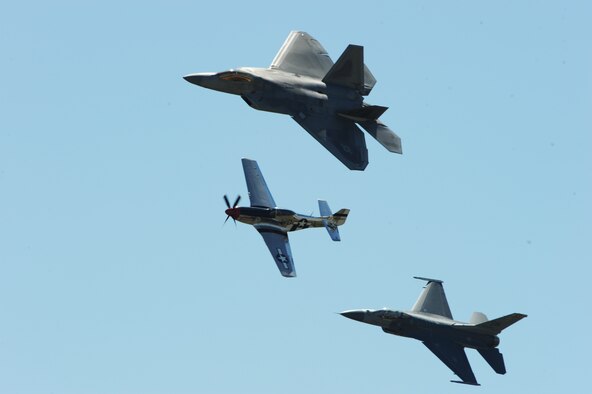 JOINT BASE ANDREWS, Md. -- An Air Force P-51 Mustang, F-16 Falcon, and F-22 Raptor perform a “Heritage Flight” for the crowds at the 2010 Joint Service Open House here May 15.  JSOH allows members of the public an excellent opportunity to meet and interact with the men and women of the Armed Forces and to show them America’s skilled military. (U.S. Air Force photo by Staff Sgt. Christopher A. Marasky)