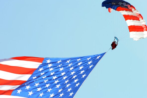 JOINT BASE ANDREWS, Md. -- E Team Skydivers guide down the American flag during the opening ceremonies of the 2010 Joint Service Open House here May 15.  JSOH allows members of the public an excellent opportunity to meet and interact with the men and women of the Armed Forces and to show them America’s skilled military. (U.S. Air Force photo by Staff Sgt. Christopher A. Marasky)