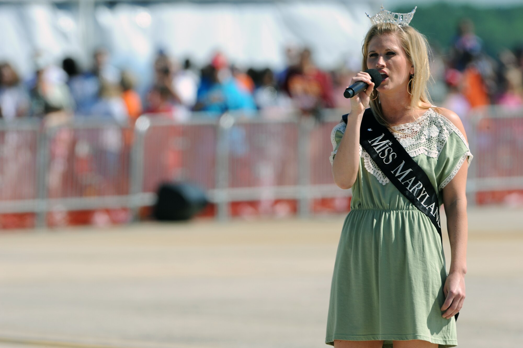 JOINT BASE ANDREWS, Md. -- Brooke Poklemba, Miss Maryland 2009, sings the National Anthem during the opening ceremonies of the 2010 Joint Service Open House here May 15.  JSOH allows members of the public an excellent opportunity to meet and interact with the men and women of the Armed Forces and to show them America’s skilled military. (U.S. Air Force photo by Staff Sgt. Christopher A. Marasky)
