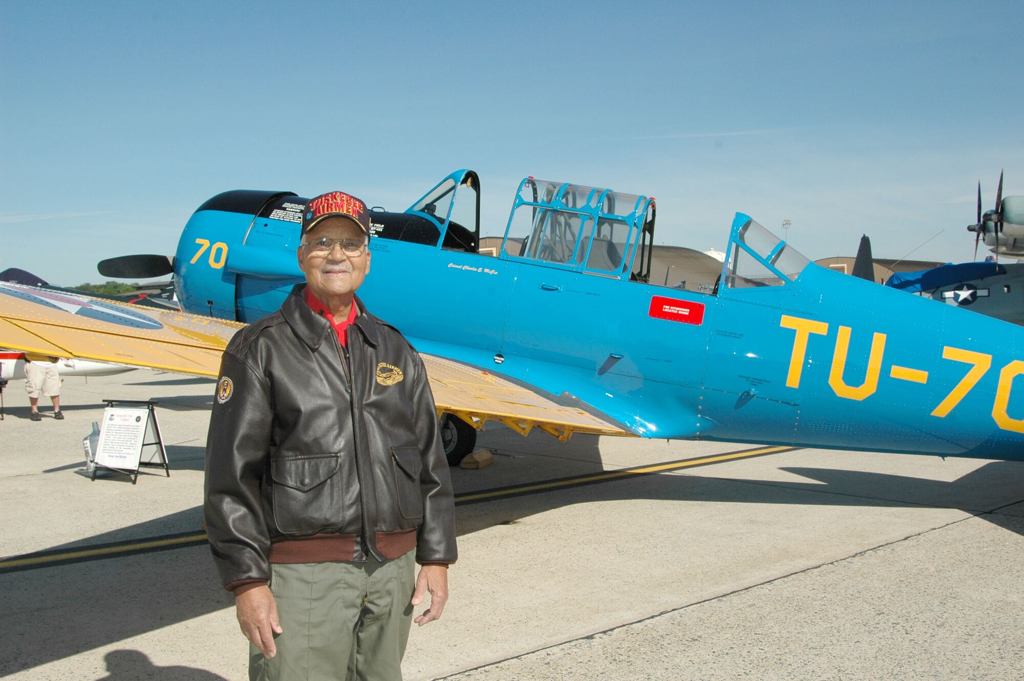 JOINT BASE ANDREWS, Md. - A Tuskegee Airman unveils a BT-13 replica.
(U.S. Navy photo by Mass Communication Specialist 2nd Class George Trian)