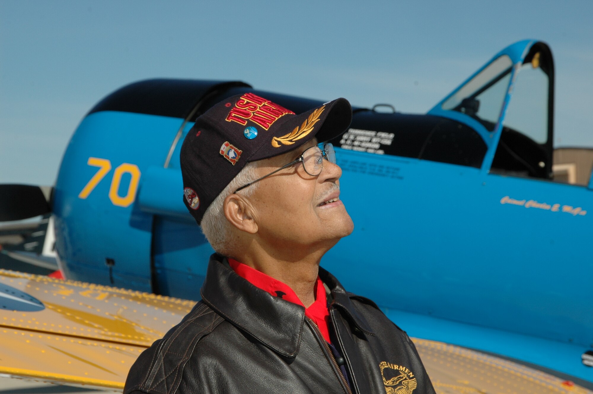 JOINT BASE ANDREWS, Md. - A Tuskegee Airman unveils a BT-13 replica.
(U.S. Navy photo by Mass Communication Specialist 2nd Class George Trian)