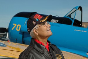 JOINT BASE ANDREWS, Md. - A Tuskegee Airman unveils a BT-13 replica.
(U.S. Navy photo by Mass Communication Specialist 2nd Class George Trian)