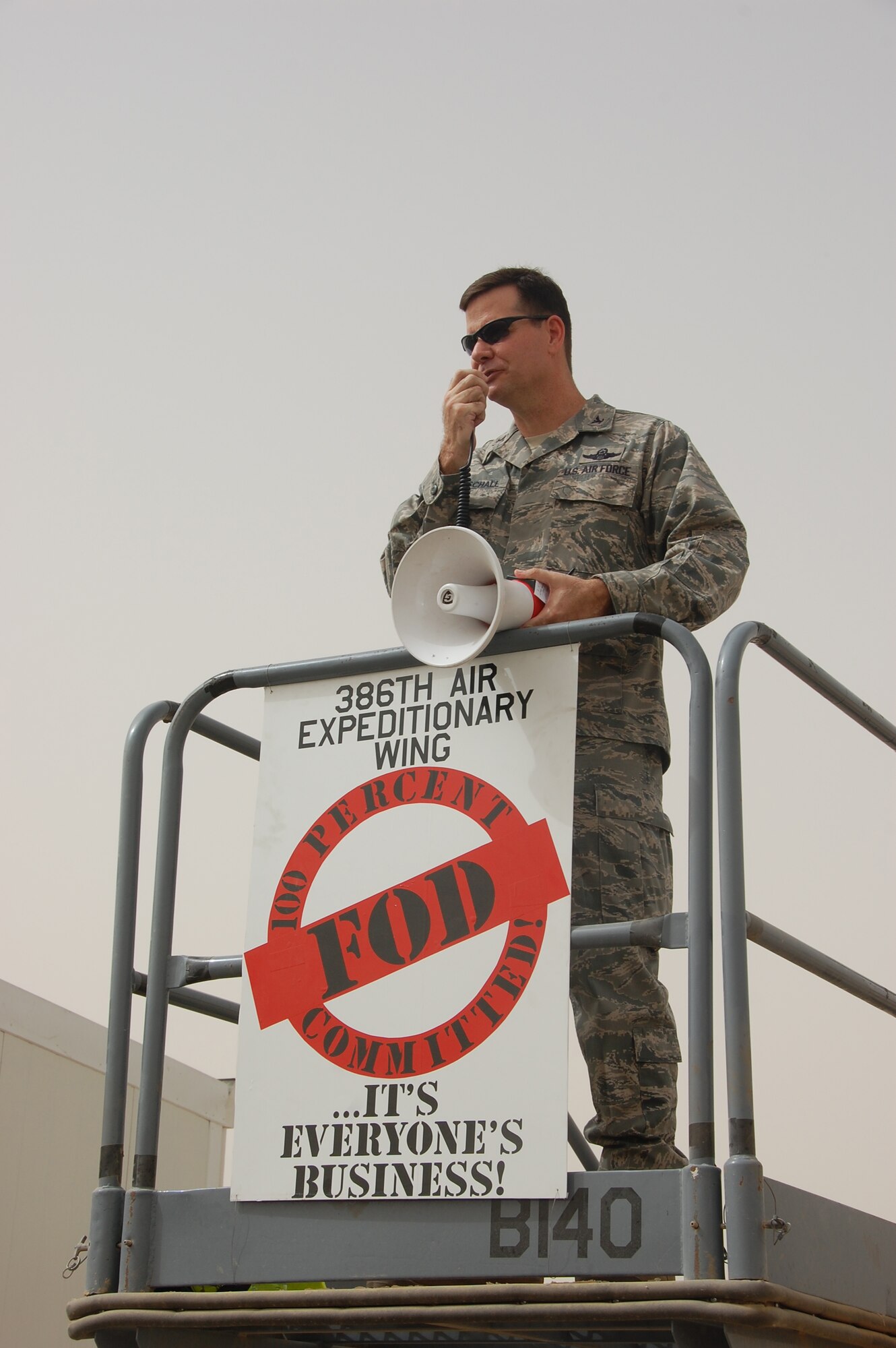 SOUTHWEST ASIA - U.S. Air Force Col. Gary Gottschall, 386th Air Expeditionary Wing vice commander,  thanks Airmen for their participation in a wing foreign object debris walk on the base airfield here May 15, 2010. Airmen participate in the FOD walk quarterly to ensure trash and other debris remains clear of the airfield to prevent damage to aircraft engines. (U.S. Air Force photo by Staff Sgt. Lakisha A. Croley/Released)