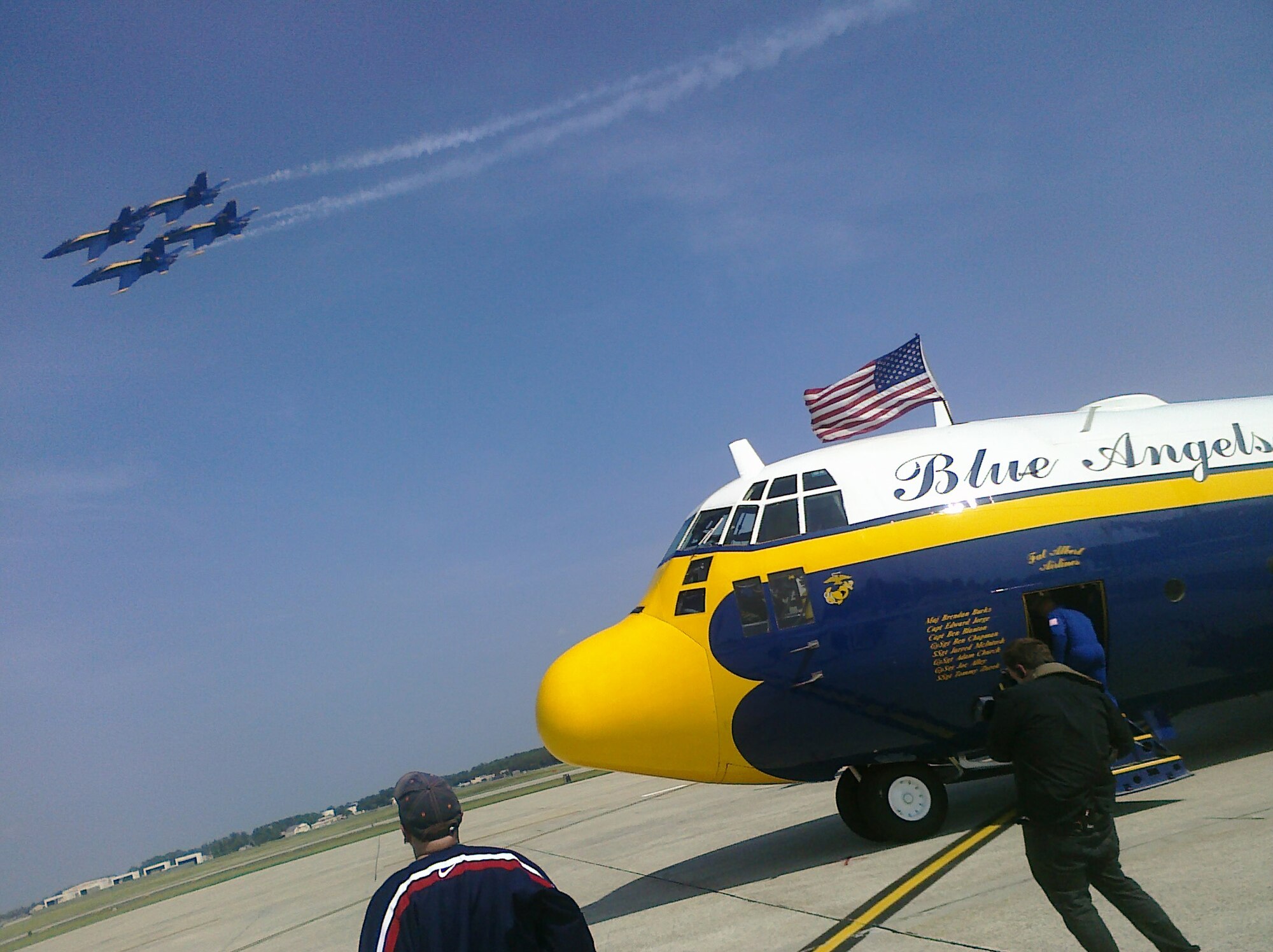 JOINT BASE ANDREWS, Md.--Mr. Duff Goldman, owner of Charm City Cakes in Baltimore and star of The Food Network's program "Ace of Cakes'', watches as the Navy's aerial demonstration team The Blue Angels, passes overhead. Goldman flew aboard the Angel's C-130 Hercules nicknamed "Fat Albert". (U.S. Air Force photo by Major Alana Casanova)