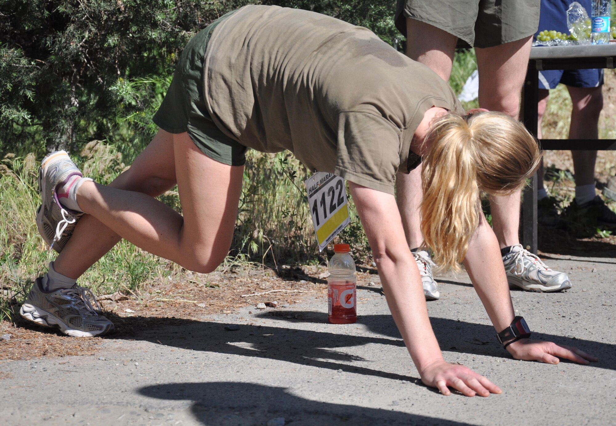 The 376th Expeditionary Force Support Squadron organized a half marathon May 15, 2010, for the Transit Center at Manas, Kyrgyzstan. Several runners relayed, each taking half the run; others finished the full 13.1 miles along a course which bordered the flight line, coming in toward the finish with crowds cheering them on. Airmen, Soldiers, Sailors, Marines, contractors, and Defense Department civilians assigned and transiting through Manas all participated. (U.S. Air Force photo/Staff Sgt. Carolyn Viss)