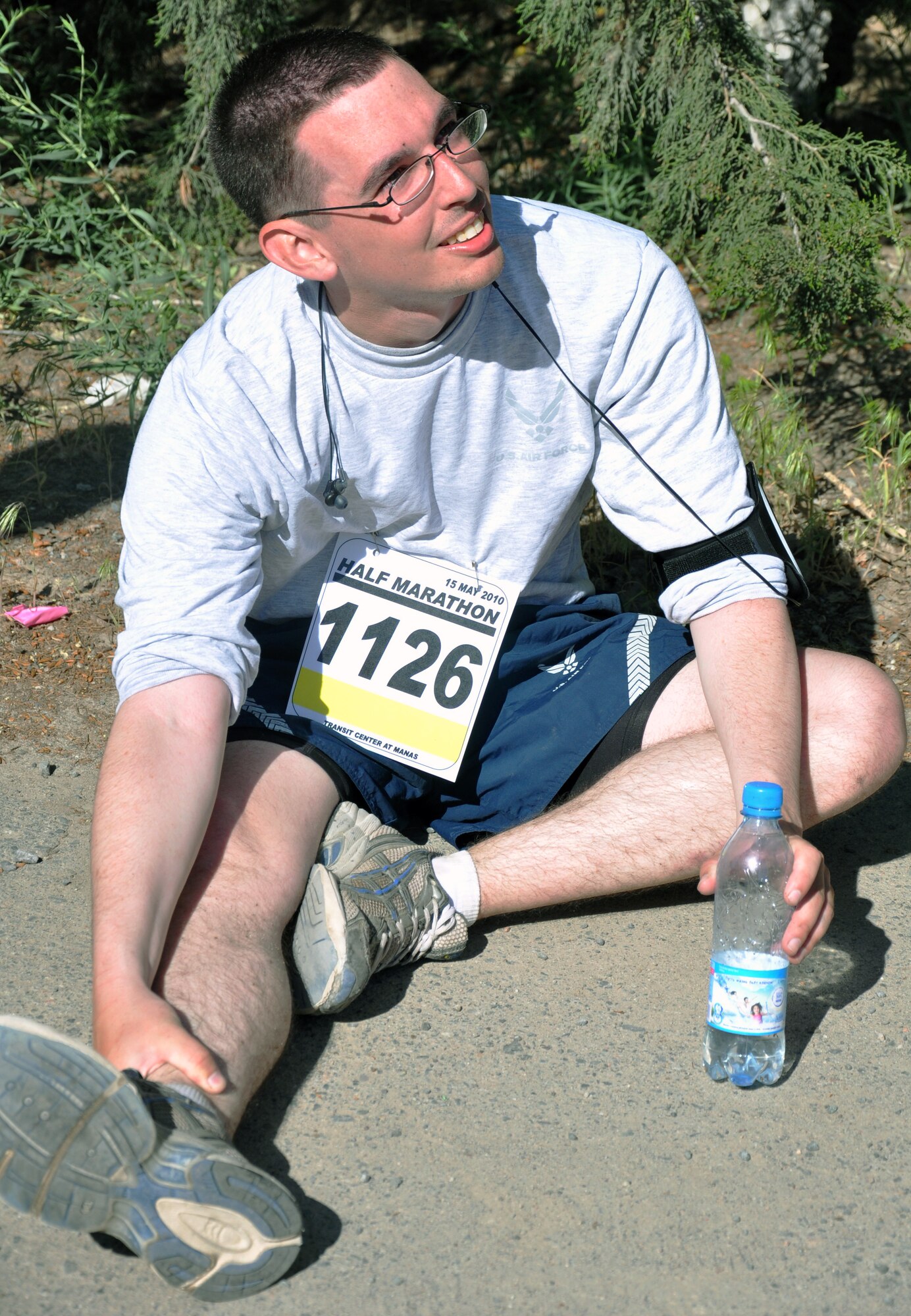 The 376th Expeditionary Force Support Squadron organized a half marathon May 15, 2010, for the Transit Center at Manas, Kyrgyzstan. Several runners relayed, each taking half the run; others finished the full 13.1 miles along a course which bordered the flight line, coming in toward the finish with crowds cheering them on. Airmen, Soldiers, Sailors, Marines, contractors, and Defense Department civilians assigned and transiting through Manas all participated. (U.S. Air Force photo/Staff Sgt. Carolyn Viss)