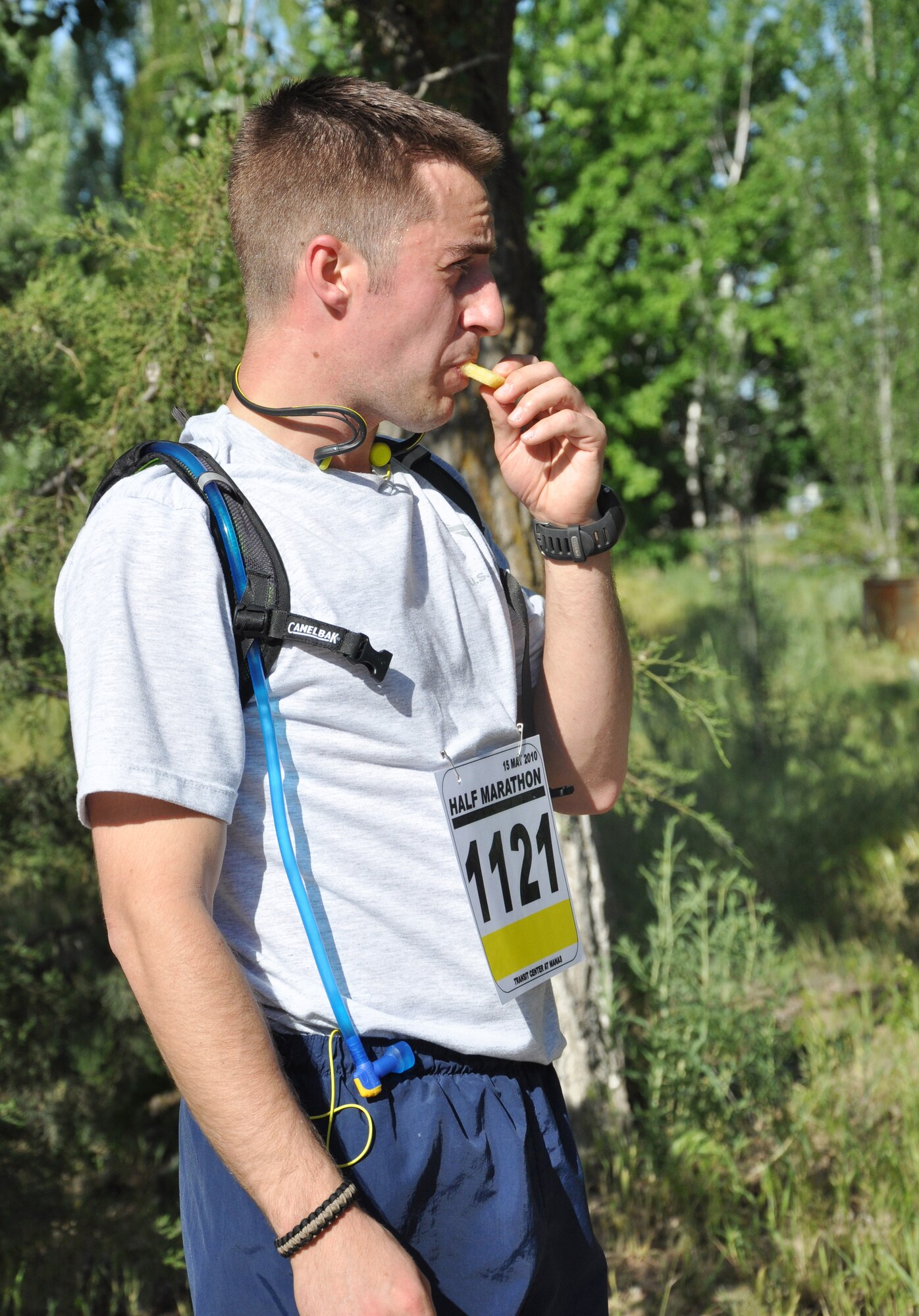 The 376th Expeditionary Force Support Squadron organized a half marathon May 15, 2010, for the Transit Center at Manas, Kyrgyzstan. Several runners relayed, each taking half the run; others finished the full 13.1 miles along a course which bordered the flight line, coming in toward the finish with crowds cheering them on. Airmen, Soldiers, Sailors, Marines, contractors, and Defense Department civilians assigned and transiting through Manas all participated. (U.S. Air Force photo/Staff Sgt. Carolyn Viss)