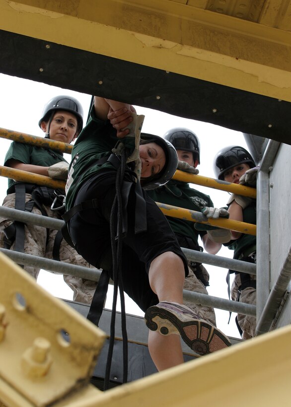 Spouses of Marine Corps Recruit Depot San Diego Marines fast rope down the depot's 50-foot rappel tower during Jayne Wayne Day, May 15. The spouses also participated in close order drill, the Confidence Course and the Indoor Simulated Marksmanship Trainer. Jayne Wayne Day gives Marine spouses a first-hand look at what their loved ones do on a daily basis and allows them to experience not only the physical and mental challenges, but also the camaraderie