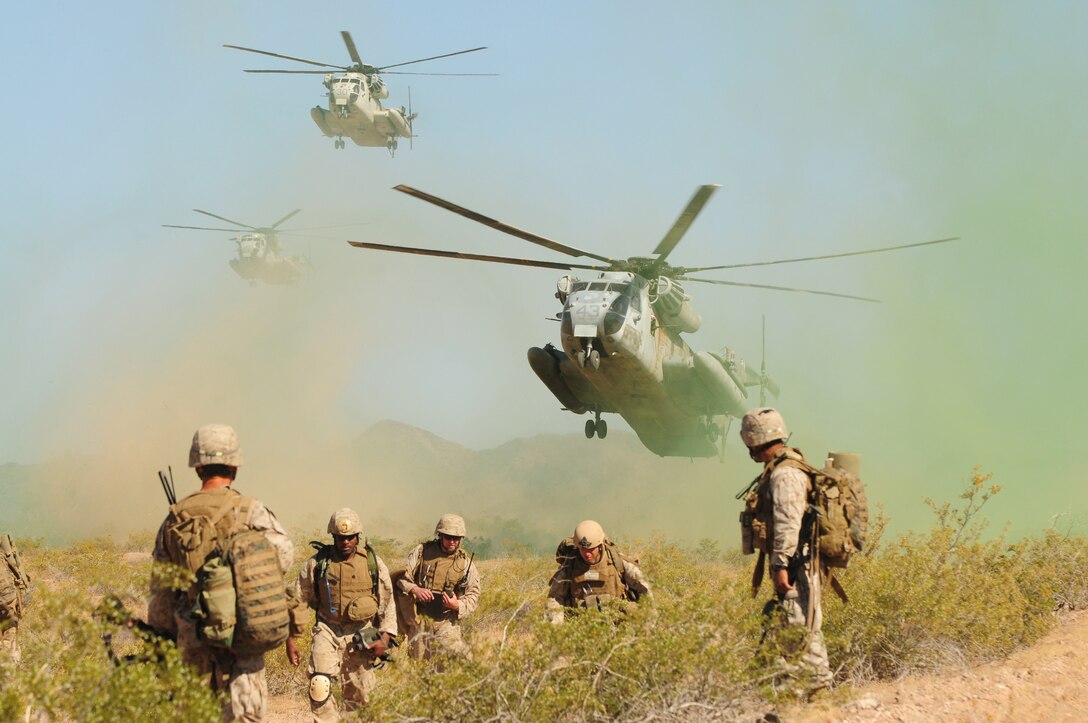 CH-53D Sea Stallions approach for landing to pick up Marines with Company A, 1st Battalion, 1st Marine Regiment, after they completed a helicopter raid at Barry M. Goldwater Range in Arizona, May 15, 2010. “The Marines did outstanding and were very well-focused,” said Capt. James Richardson, company commanding officer. “We learned a lot of valuable lessons. We got dropped off farther than we expected, but the platoons still communicated well with each other, letting each other know where the other was. It was an outstanding opportunity to have a tactical environment.” The raid was their final exercise for the Weapons and Tactics Instructor course taught by Marine Aviation Weapons and Tactics Squadron 1 at the Marine Corps Air Station in Yuma, Ariz.