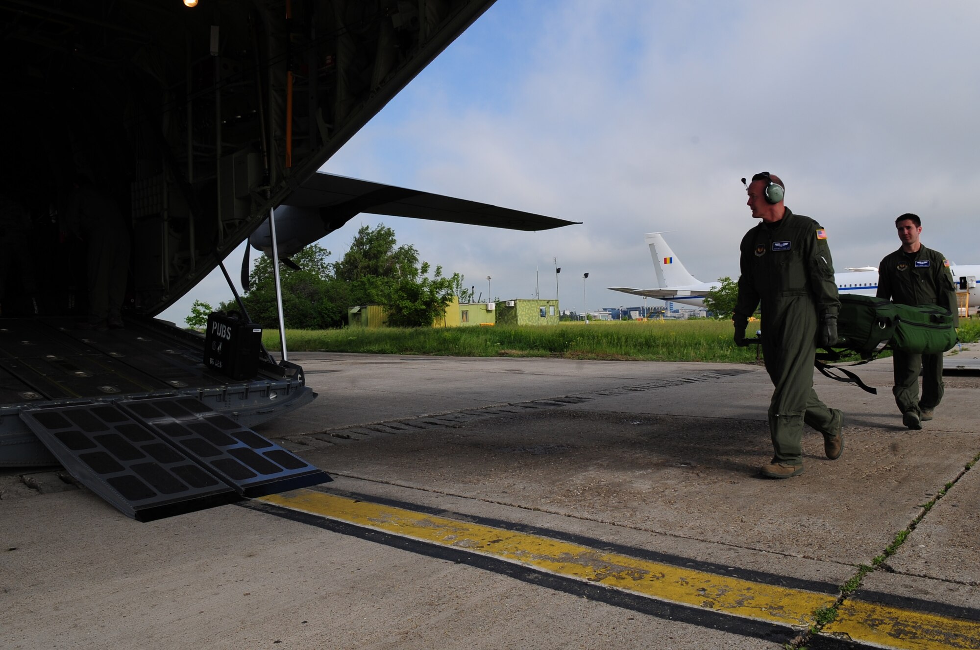 U.S. Air Force Captain Erskine Cook Jr. and Staff Sgt. Chance Medley both from 86th Aeromedical Evacuation Squadron, load medical equipment onto a U.S. Air Force C-130J in preparation for a medical evacuation exercise with their Romanian counterparts during exercise Carpathian Summer, Otopeni Airlift Base, Romania, May 14, 2010. Carpathian Summer 2010 was an exercise in which the Romanian Air Force invited members of the U.S. military to train with them on their soil and air space, to observe and practice, firsthand, operations in action. This exercise was designed to build partnerships between these nations in an effort to work together more efficiently during real world scenarios. (U.S. Air Force Photo by Staff Sgt. Jocelyn Rich)
