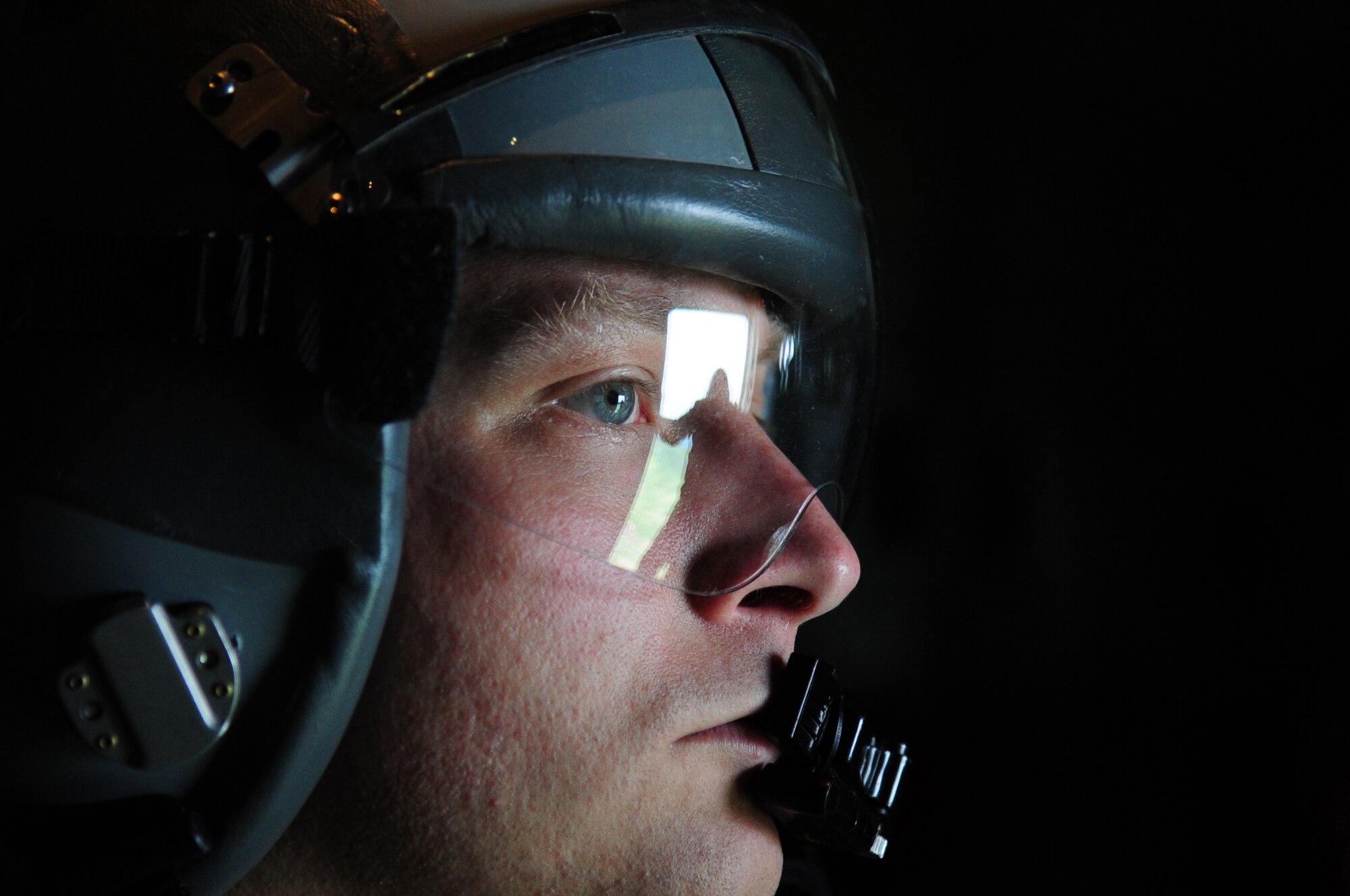 U.S. Air Force Tech. Sgt. David Dias, 37th Airlift Squadron loadmaster, looks on as a Romanian jump master looks out the side door of a C-130J in preparation for Romanian paratrooper to exit, Camp Turzii, Romania, May 13, 2010. Carpathian Summer 2010 was an exercise in which the Romanian Air Force invited members of the U.S. military to train with them on their soil and air space, to observe and practice, firsthand, operations in action. This exercise was designed to build partnerships between these nations in an effort to work together more efficiently during real world scenarios. (U.S. Air Force Photo by Staff Sgt. Jocelyn Rich)