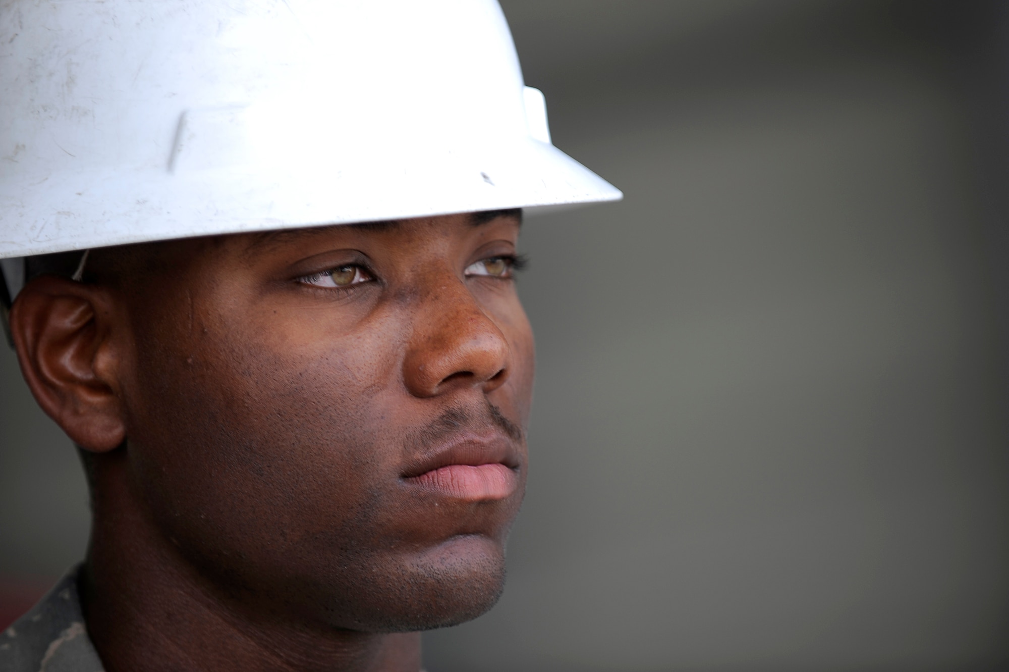 U.S. Air Force Senior Airman Cameron Mosley, 455th Expeditionary Civil Engineer Squadron, provides force protection as contractors perform construction work on a new hangar at Bagram Airfield, Afghanistan, May 12, 2010. Airman Mosley is deployed from Ramstein Air Base, Germany, and is from South Haven, Mich. (U.S. Air Force photo by/ Master Sgt. Jeromy K. Cross/released)