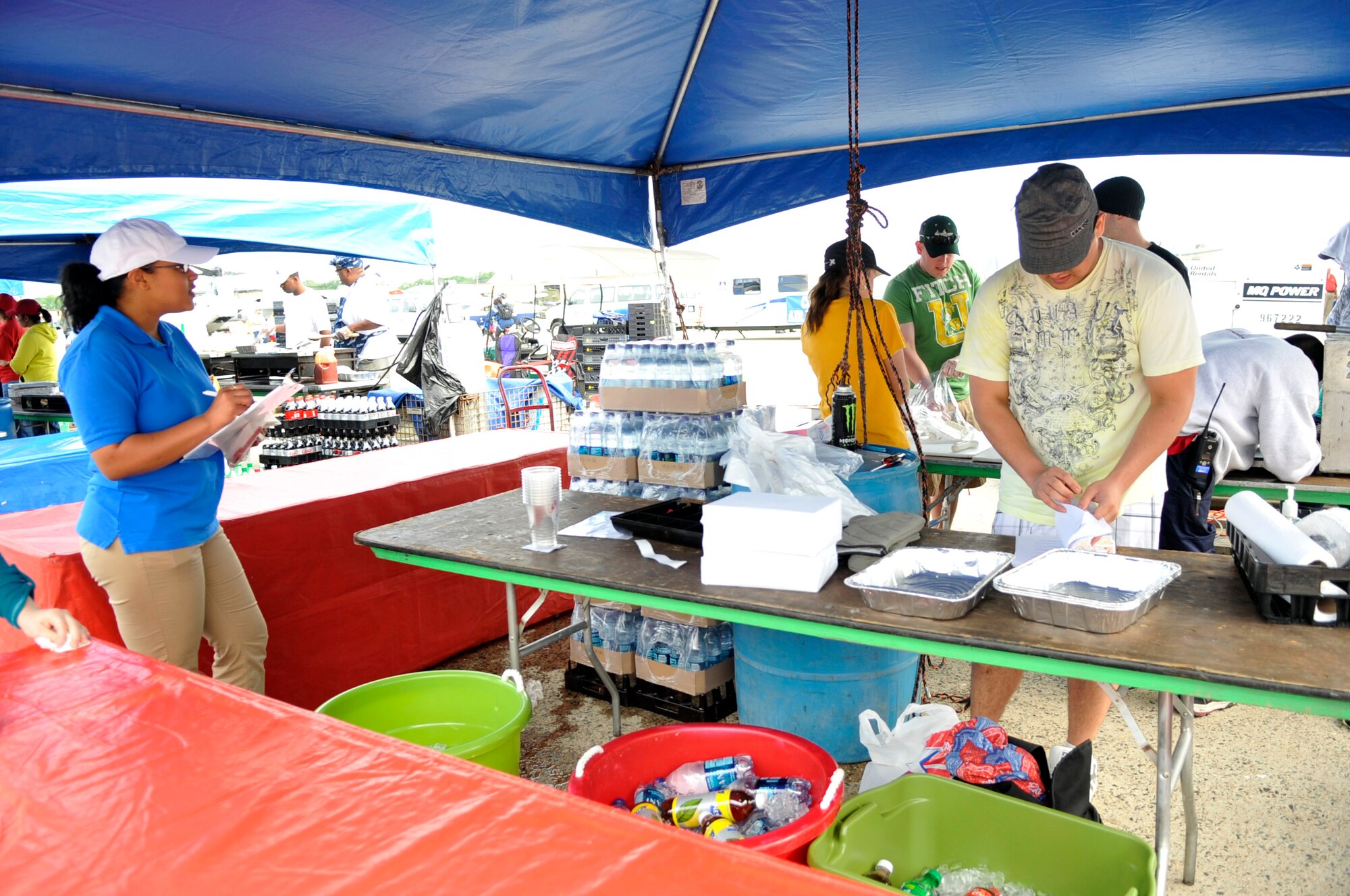 JOINT BASE ANDREWS, Md. – Air Force Staff Sgt. Danielle Costa, a public health technician with the 779th Aerospace Medicine Squadron, inspects a food booth at the Joint Service Open House here May 16. The public health team had more than 50 airmen from throughout the Air Force District of Washington inspecting every food booth three times a day ensuring food preparers comply with guidelines for sanitation, hygiene and food temperatures. (U.S. Air Force photo by Staff Sgt. Renae L. Saylock)