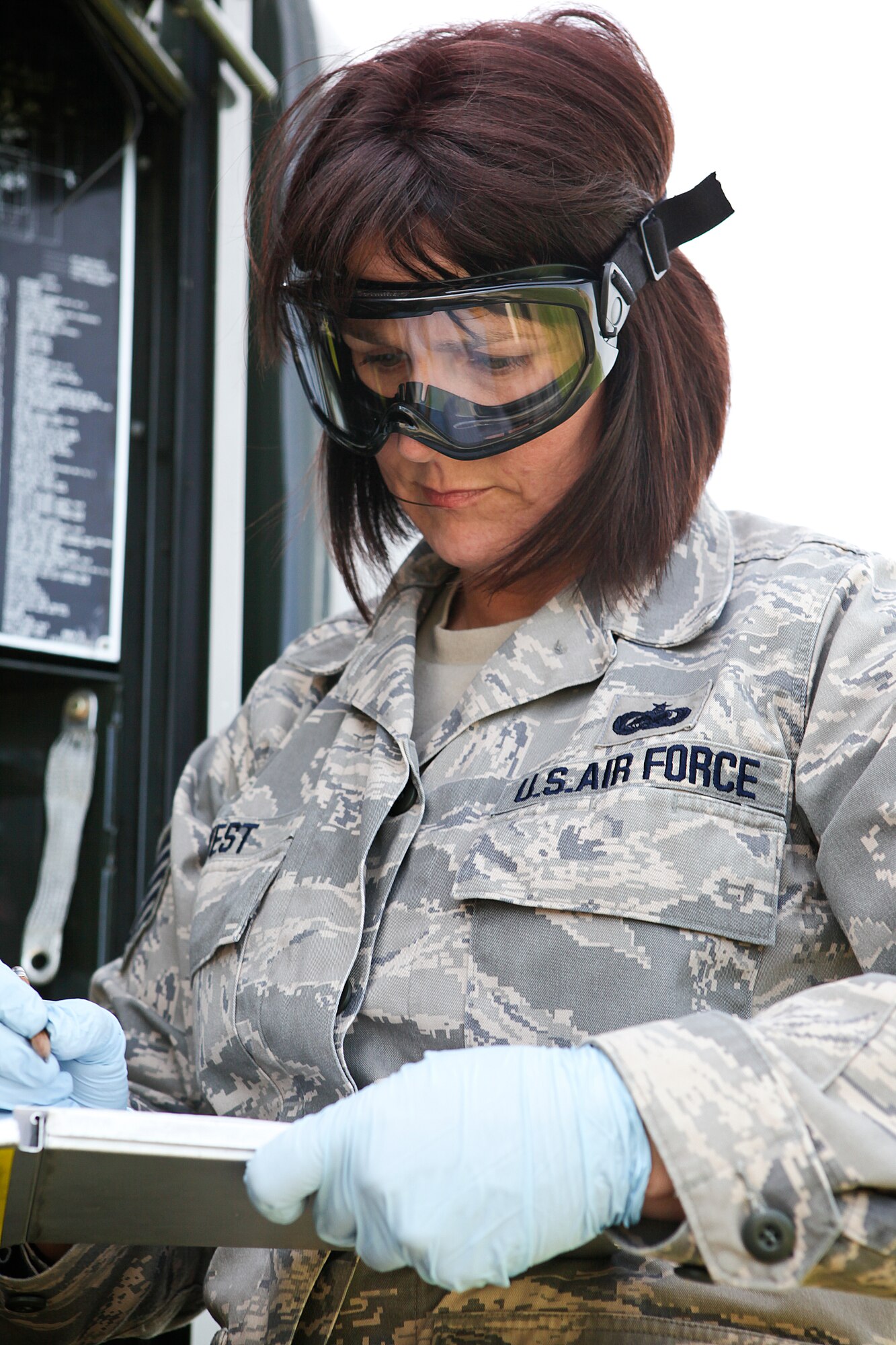 Technical Sgt. Debora West fills in an inspection log after collecting a sample of JP-8 jet fuel from an R-11 fueling truck as part of a routine quality assurance inspection of the truck’s fuel at Selfridge Air National Guard Base, May 15, 2010. Air Force fuels specialists are charged with routinely inspecting the fuel they provide to ensure that it is both “clean” – that it contains no containments – and that it is “dry” – that it contains no water. (U.S. Air Force photo by Master Sgt. Terry Atwell) (RELEASED)