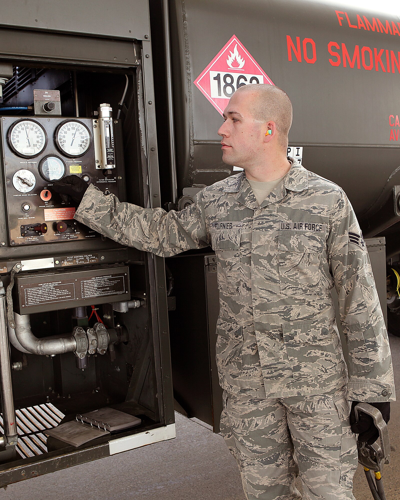 Senior Airman Joseph Fournier operates the controls of an R-11 fueling truck while provide JP-8 fuel to an A-10 Thunderbolt II aircraft at Selfridge Air National Guard Base, May 15, 2010. The R-11 is the primary ground fuels vehicle in use by the Air Force. It can hold a maximum capacity of 6,000 gallons and is able to issue fuel at a rate of up to 600 gallons per minute. (U.S. Air Force photo by Master Sgt. Terry Atwell) (RELEASED)