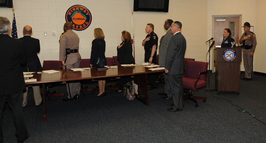 Techincal Sgt. Jennifer Koonce, from the 125th Fighter Wing, leads the Pledge of Allegiance at a ceremony held on May 13, 2010 to sign a statement of support for the Guard and Reserve.  The ceremony was held at a Florida Highway patrol Station in Jacksonville, Fla. it was one of seven ceremonies begin held simultaneously throughout the state of Florida. (Air National Guard photo by Staff Sgt. Jaclyn Carver)